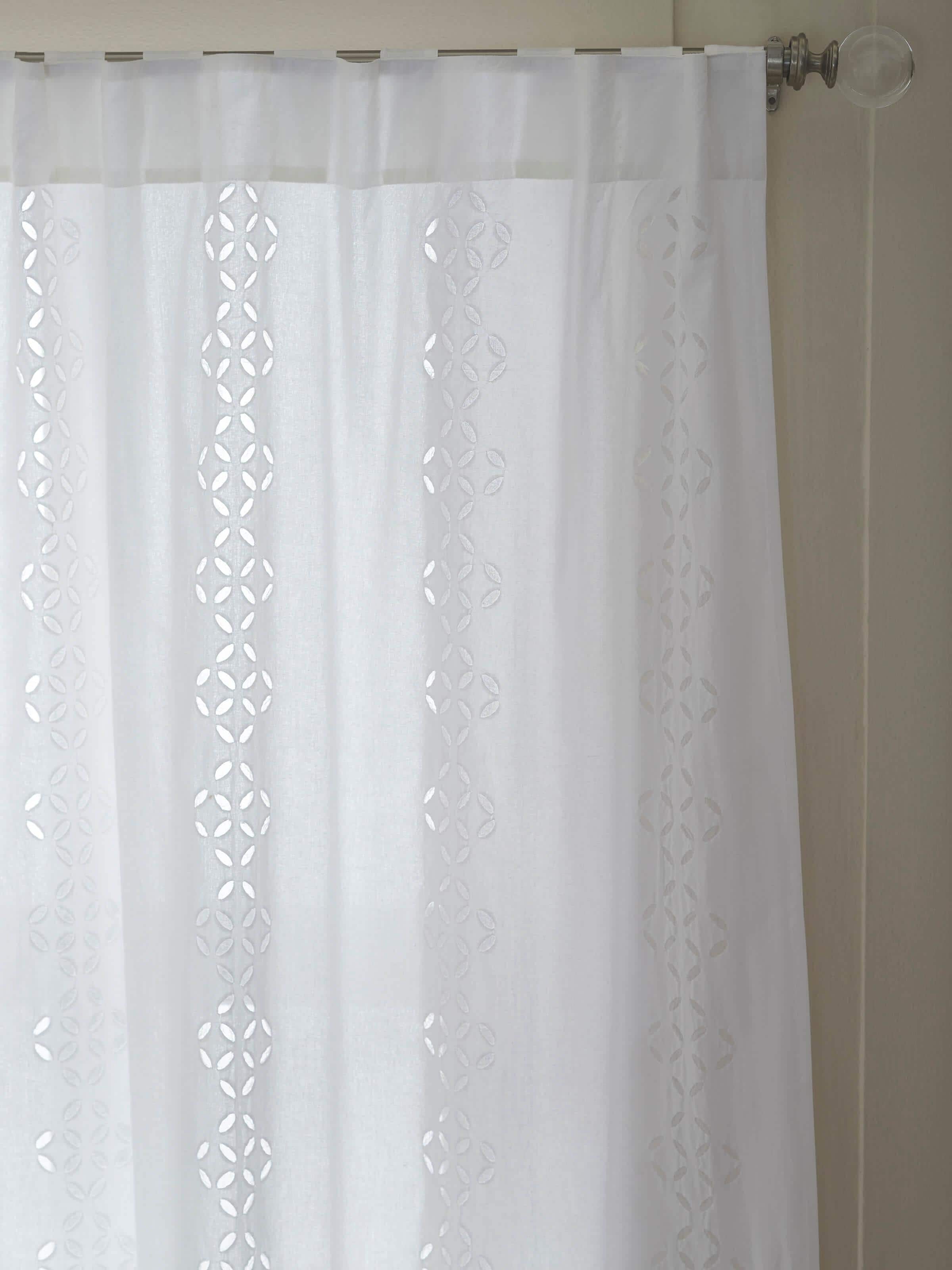 Detail shot of Mandana white sheer curtain with trellis stripes and cotton applique, capturing the fabric's texture.