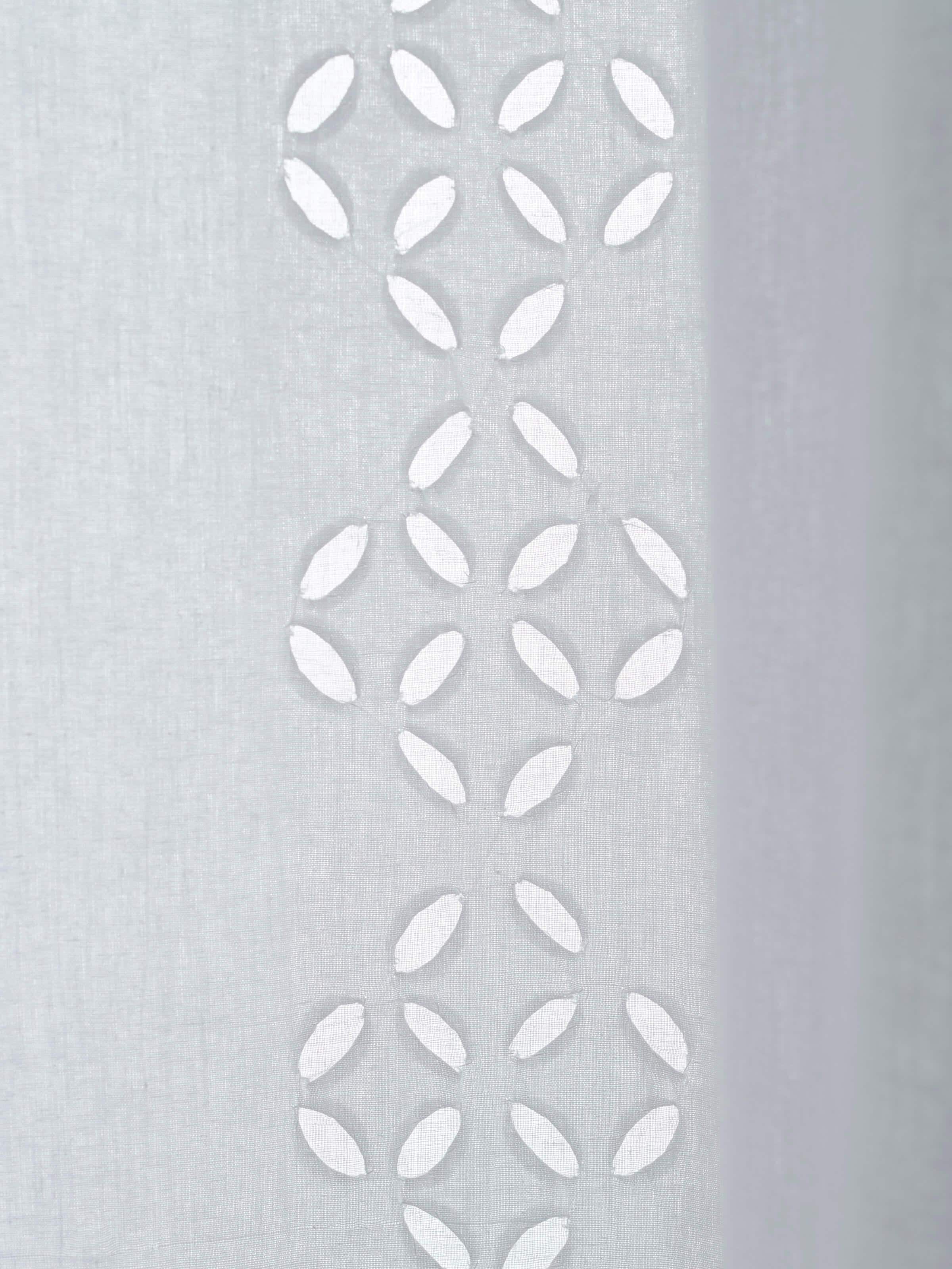 Mandana sheer curtain with a white trellis stripe and applique design, demonstrating the curtain’s light and airy quality.