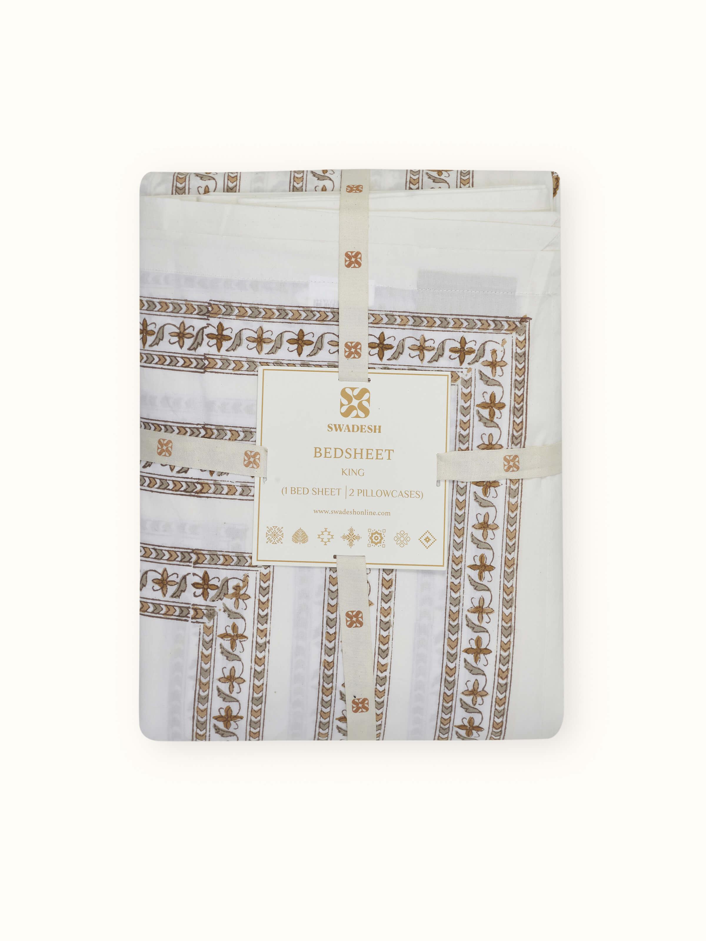 Angled view of Aarunya beige buta cotton Sanganeri block printed king bedsheet set (3 pcs), demonstrating the full design and set.
