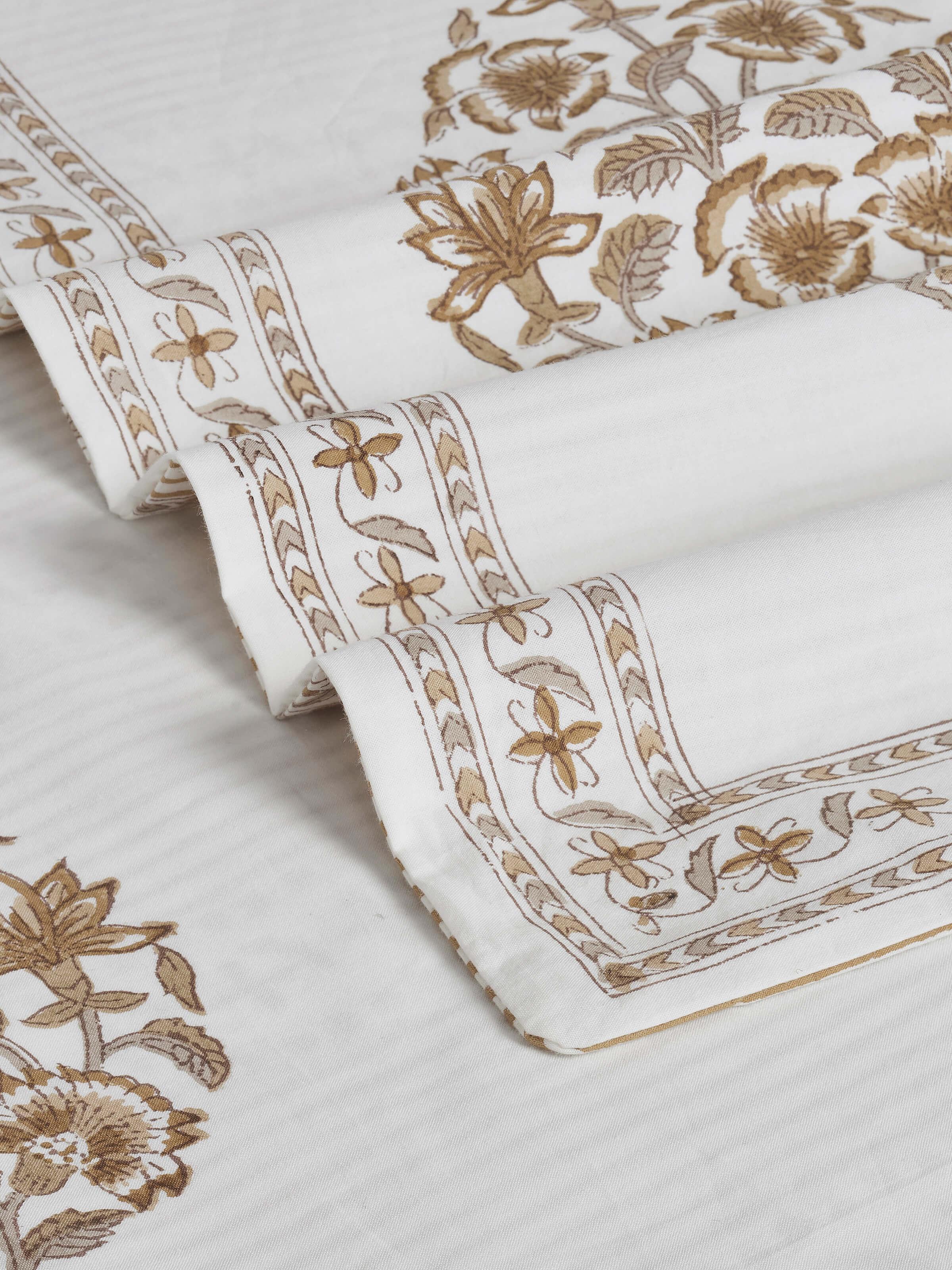 Aarunya beige buta cotton Sanganeri block printed queen bedsheet set (3 pcs) spread out to show the block print and color detail.