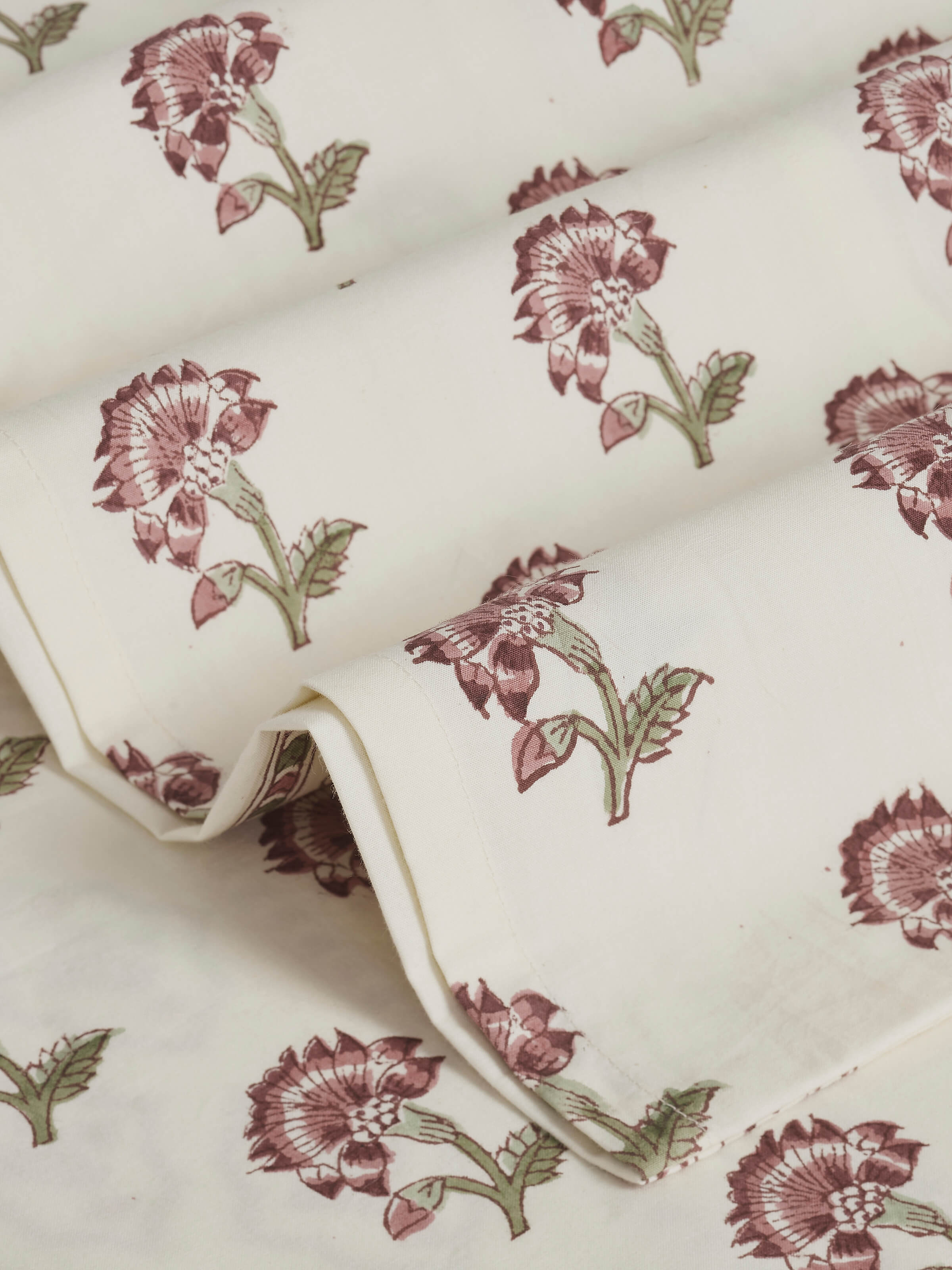 Aarunya Red Floral Cotton Sanganeri Block Printed Queen Bedsheet Set showing its rich red color and floral design.