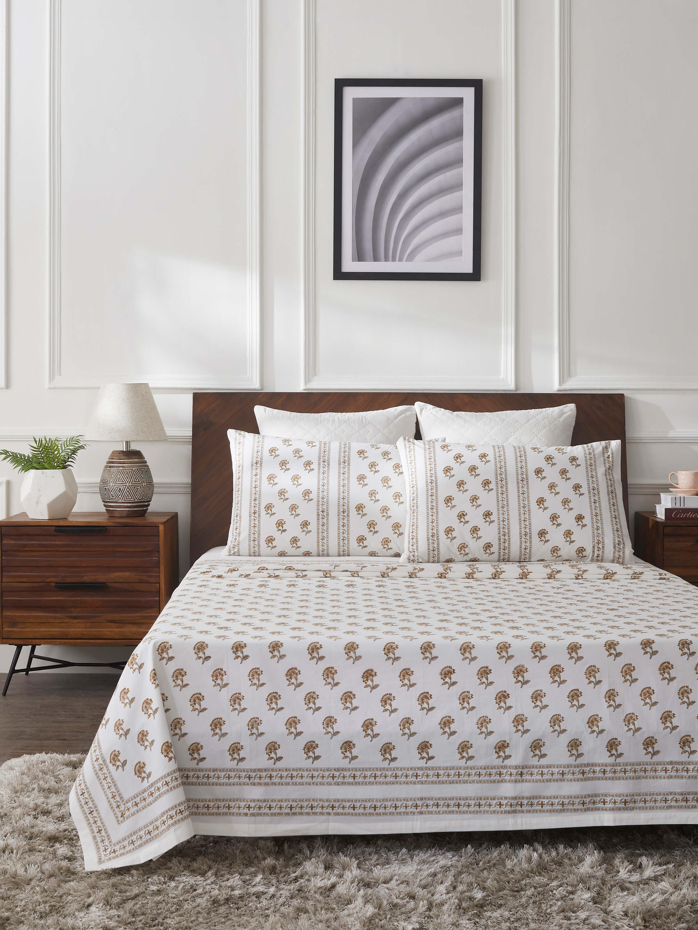 Close-up of Aarunya beige buti cotton Sanganeri block printed king bedsheet set, focusing on the intricate block prints and fabric quality.