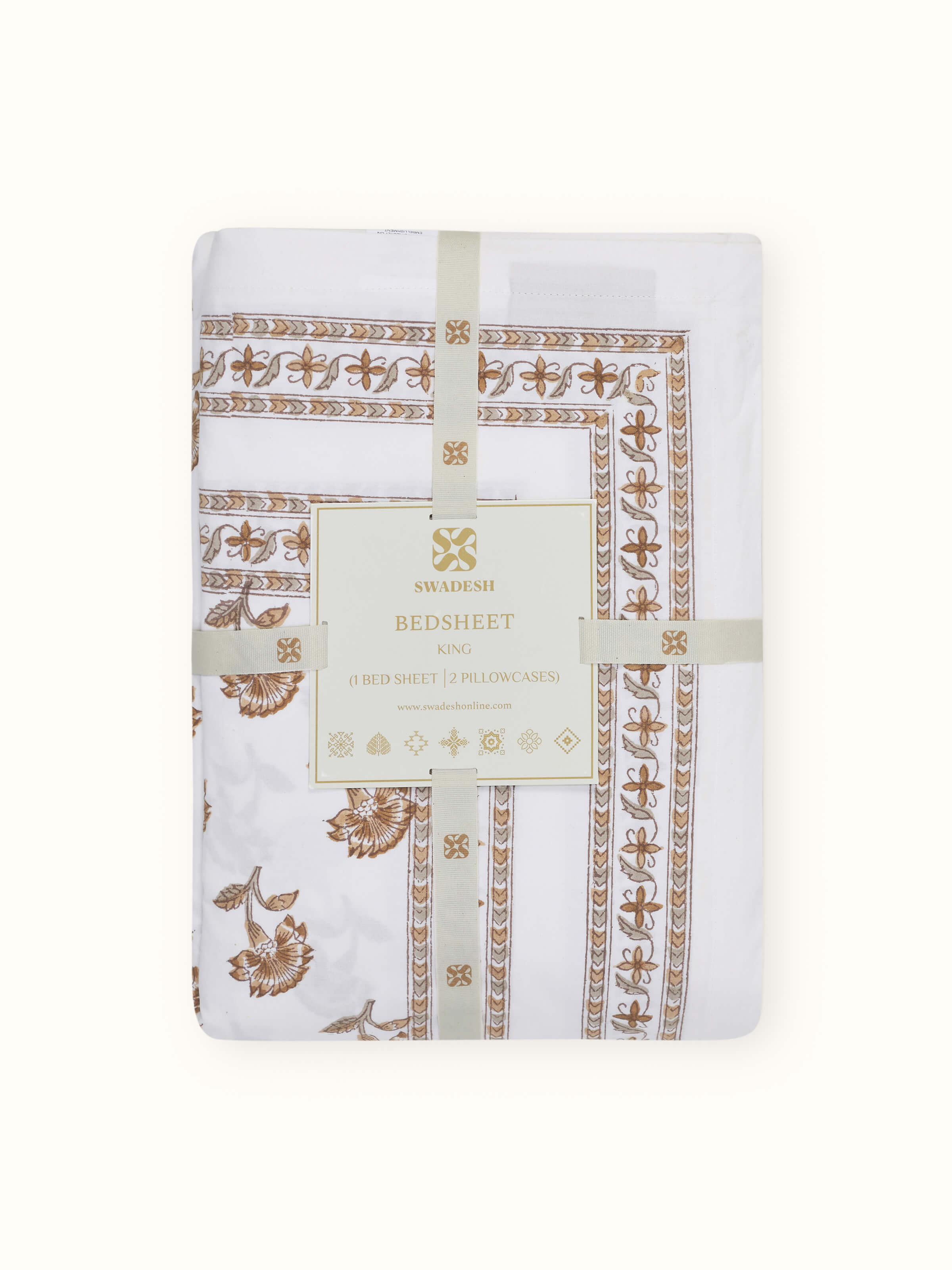 Aarunya beige buti cotton Sanganeri block printed king bedsheet set in a bedroom setting, showing its design and application.