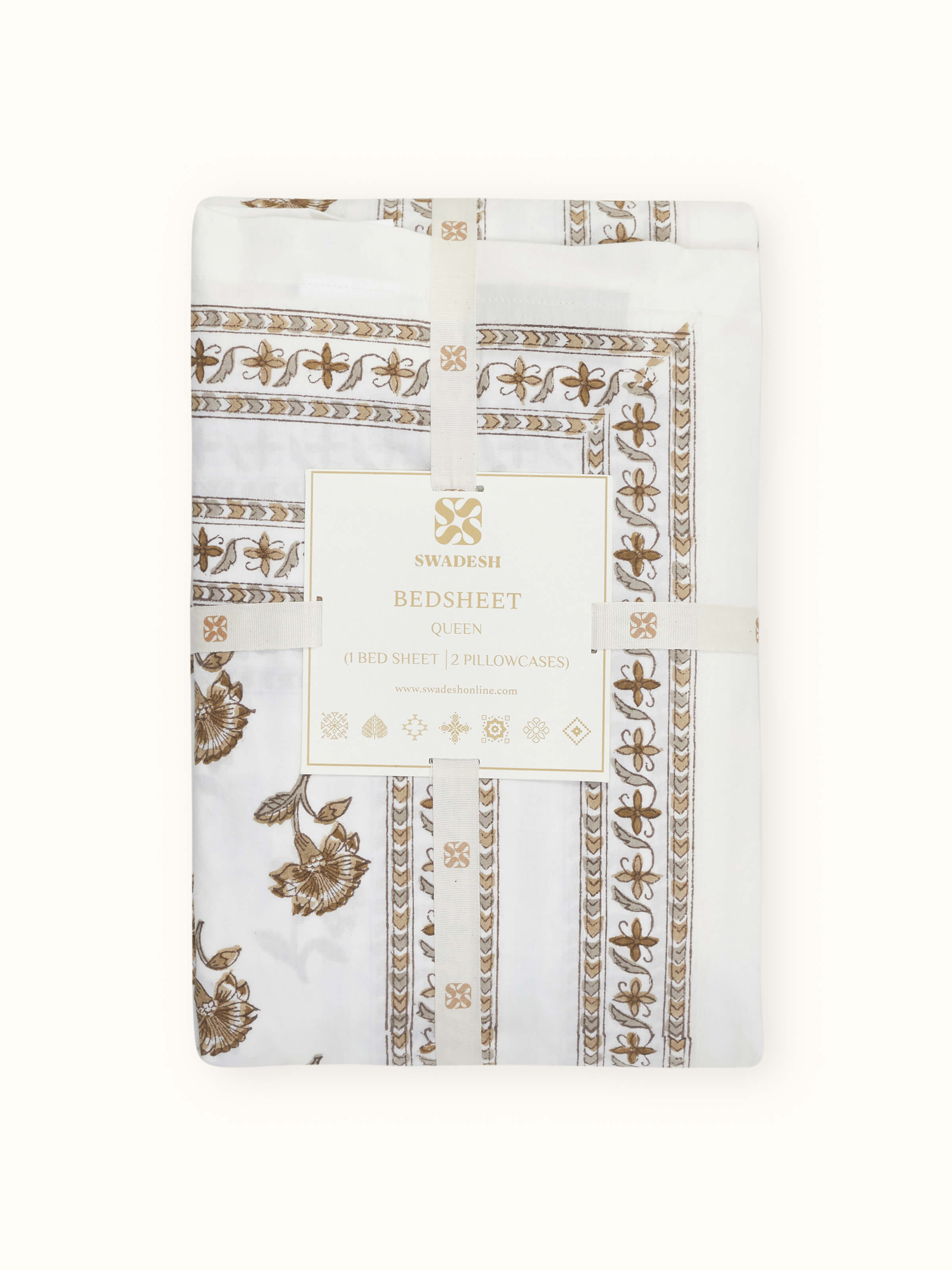 Aarunya beige buti cotton Sanganeri block printed queen bedsheet set, displayed on a bed to show the complete set in use.