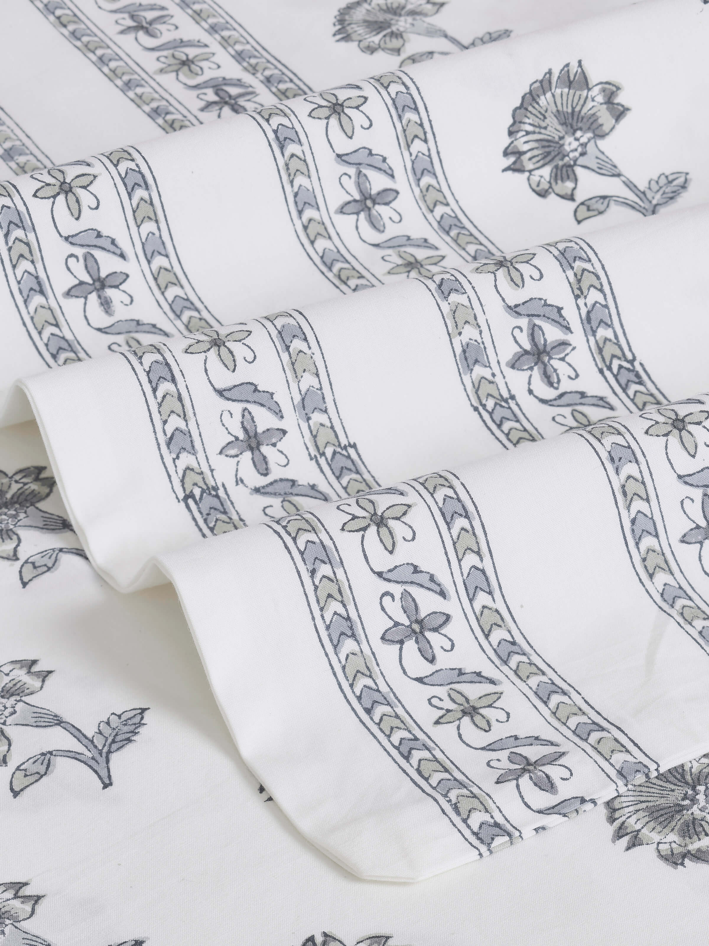 Close-up view of Aarunya grey buti cotton Sanganeri block printed queen bedsheet set (3 pcs), highlighting the intricate block print.