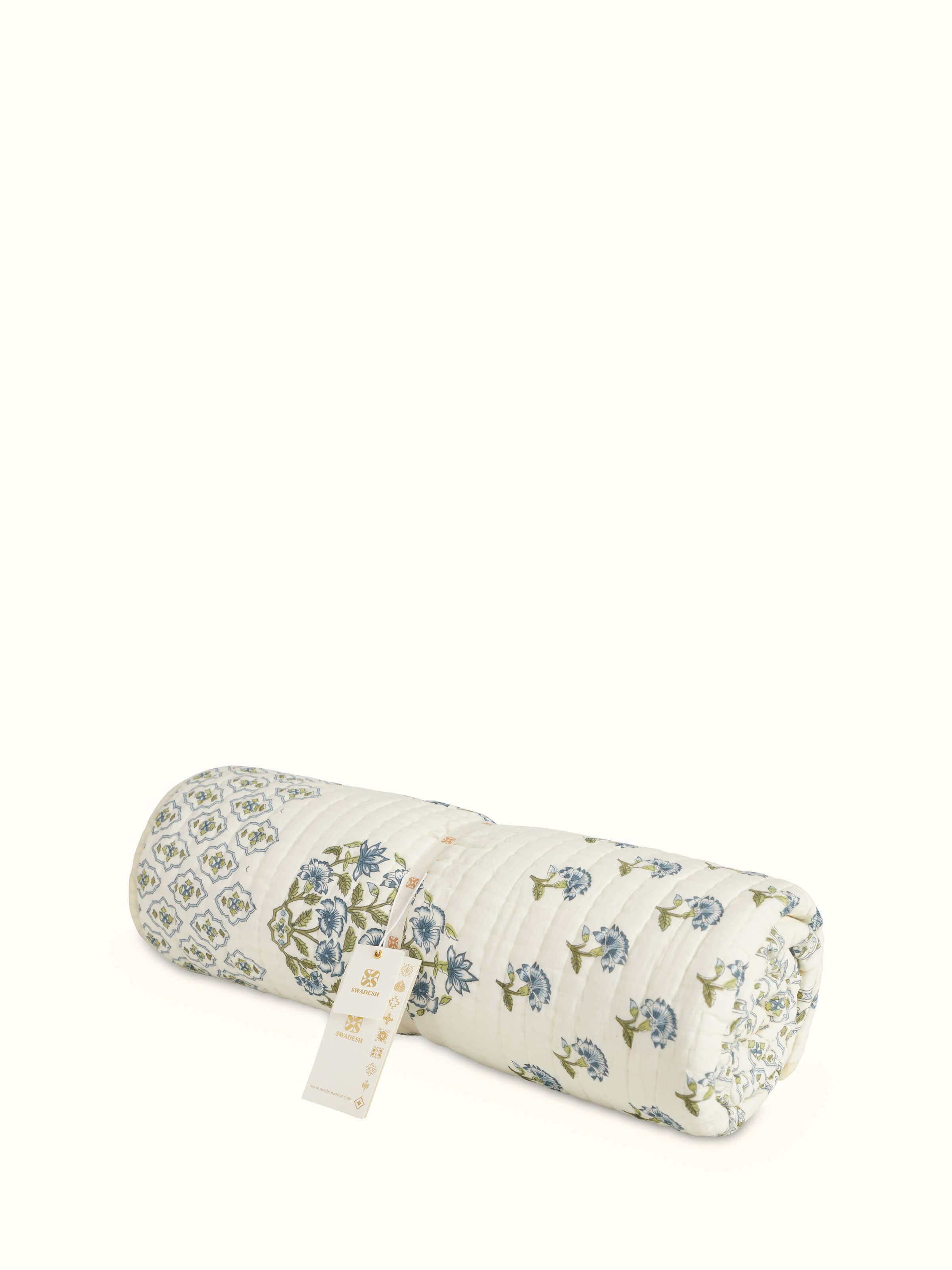 Detailed view of Aarunya blue floral cotton Sanganeri block printed single quilt focusing on the intricate floral block print