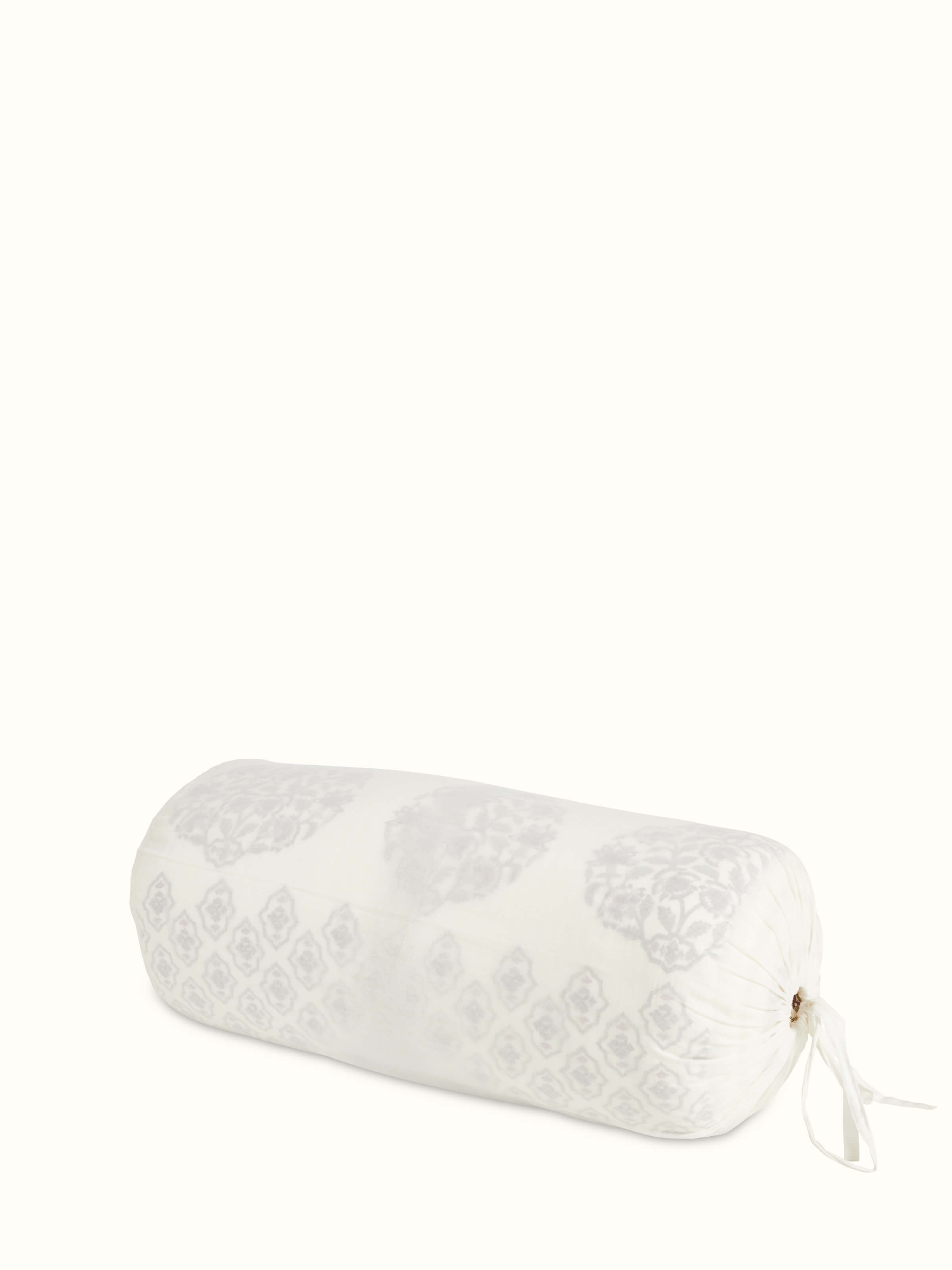 Artistic view of Aarunya red floral cotton Sanganeri block printed double quilt draped over furniture, emphasizing the rich colors