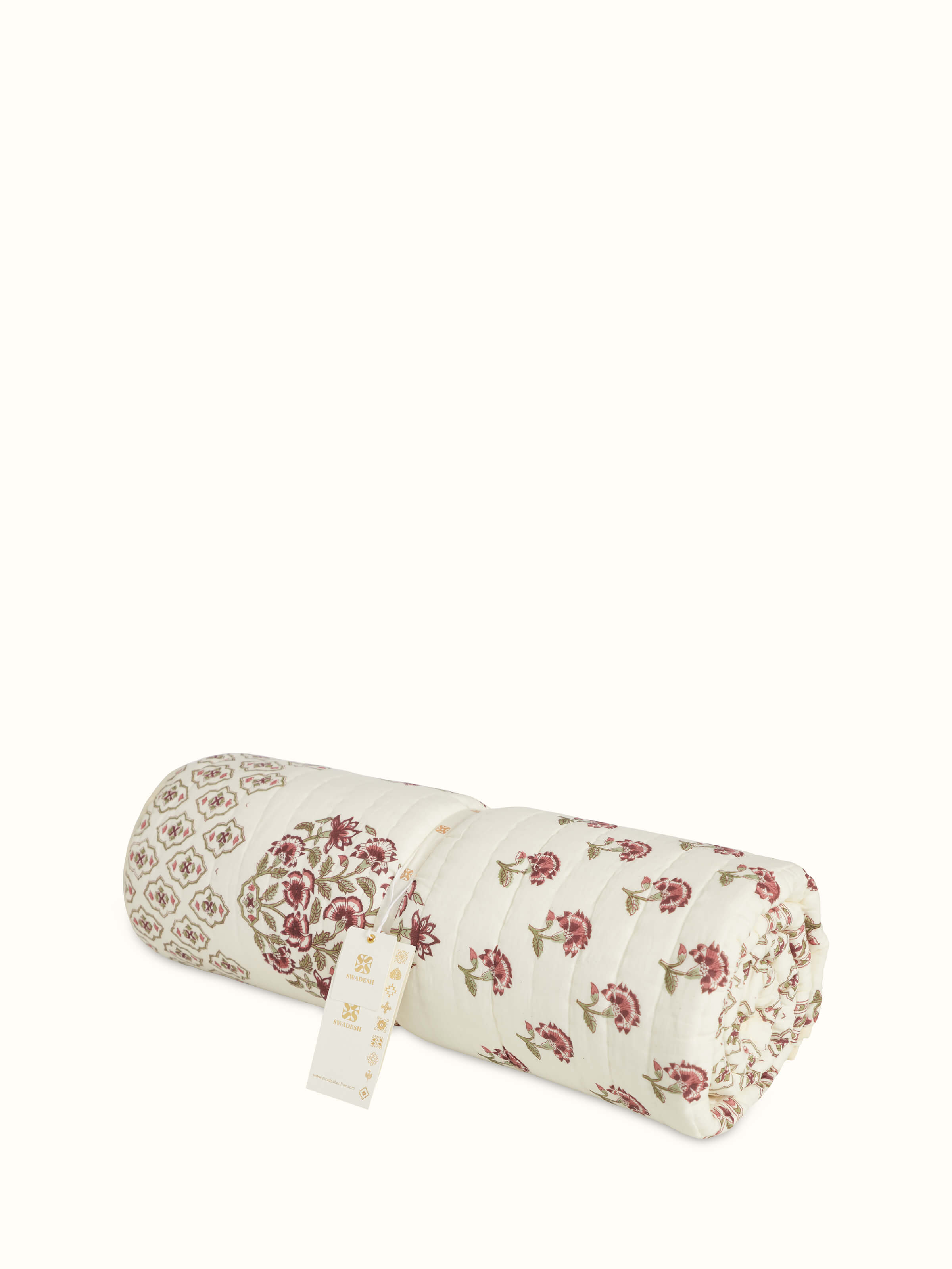 Detailed view of Aarunya red floral cotton Sanganeri block printed single quilt highlighting the rich texture and print.