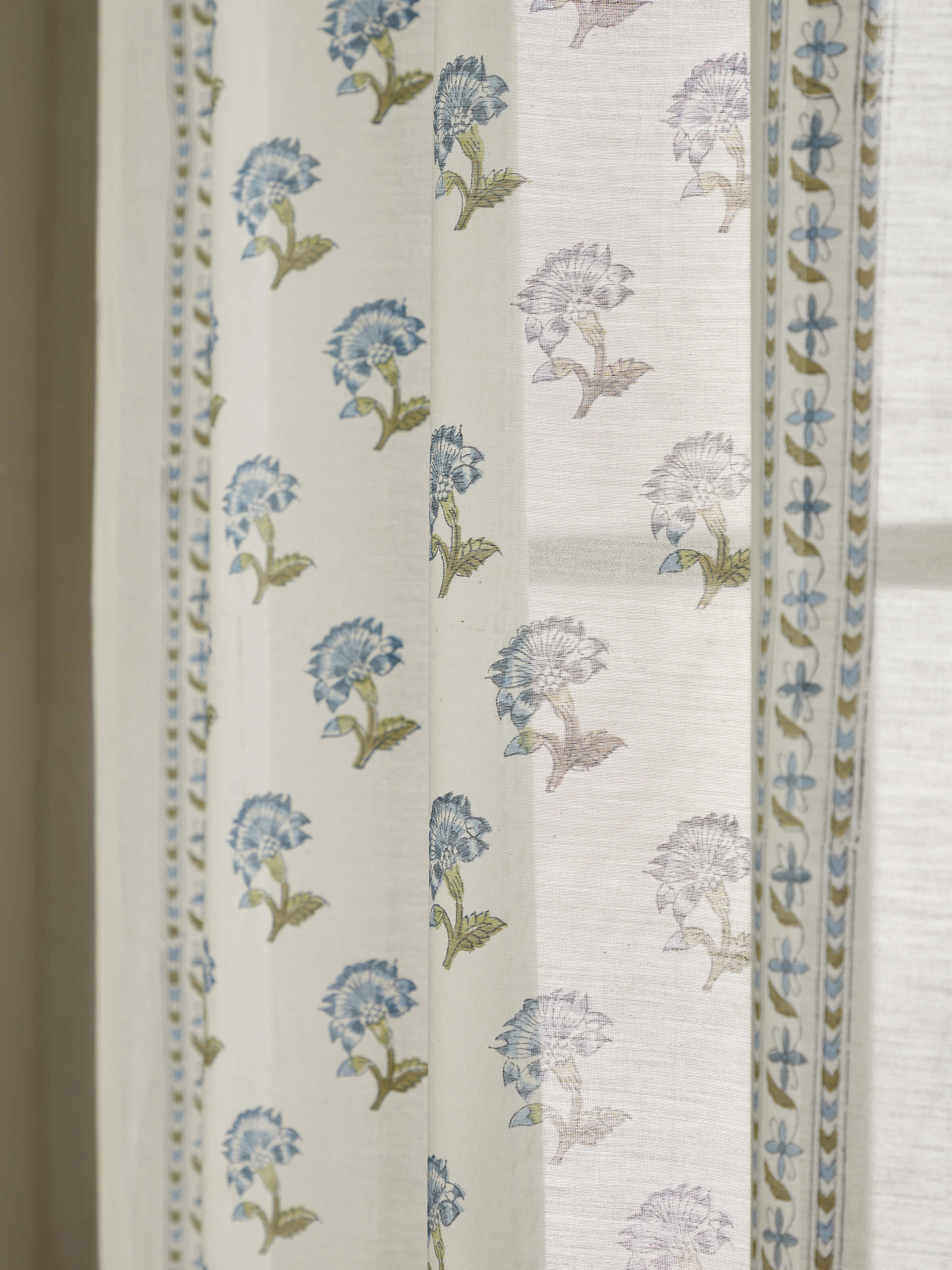 Close-up of Aaarunya blue floral stripe cotton silk Sanganeri block printed sheer curtain focusing on the fabric’s light, airy quality