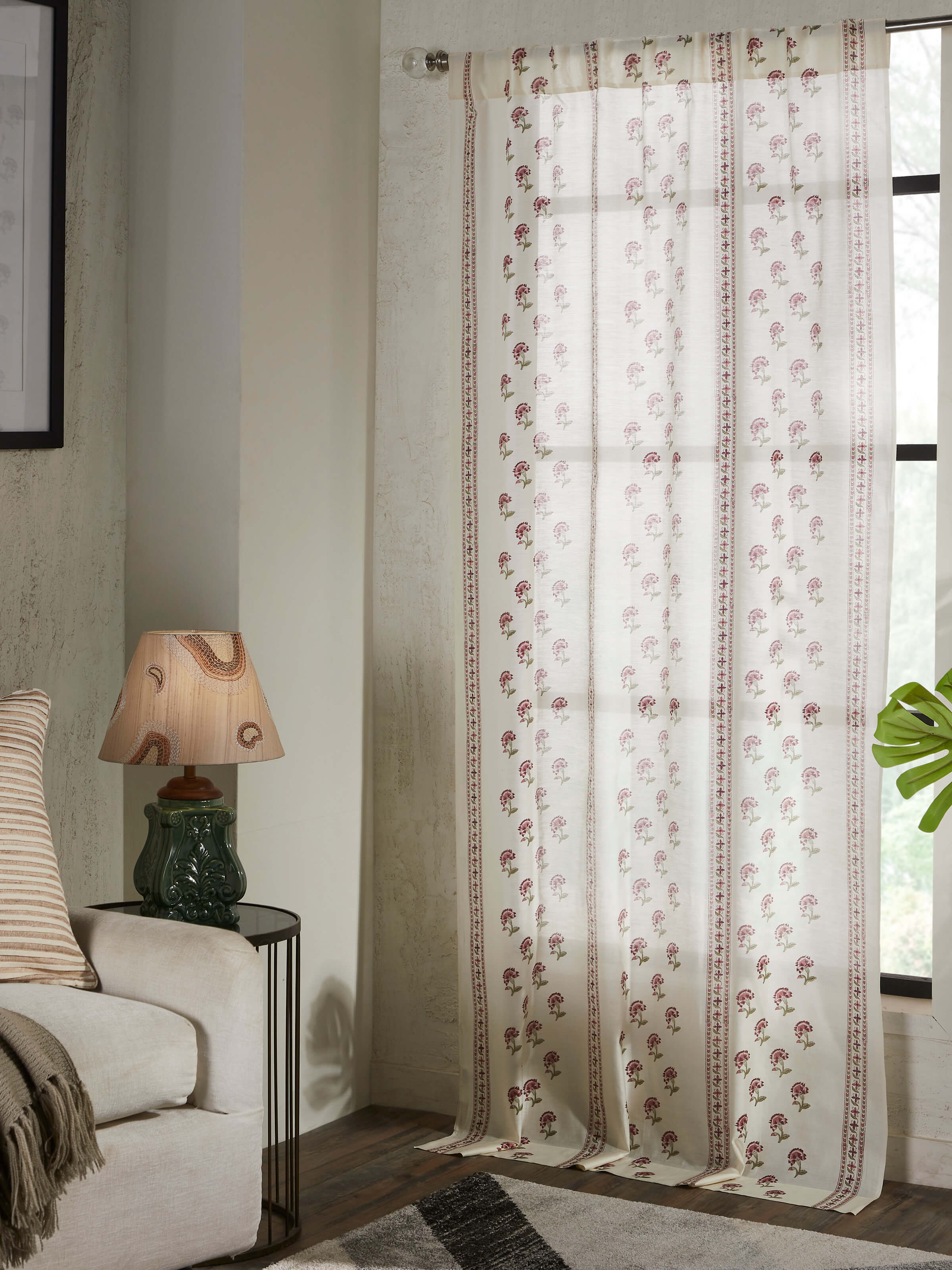 Close-up of Aarunya red floral cotton silk Sanganeri block printed sheer curtain, highlighting the delicate fabric and print.