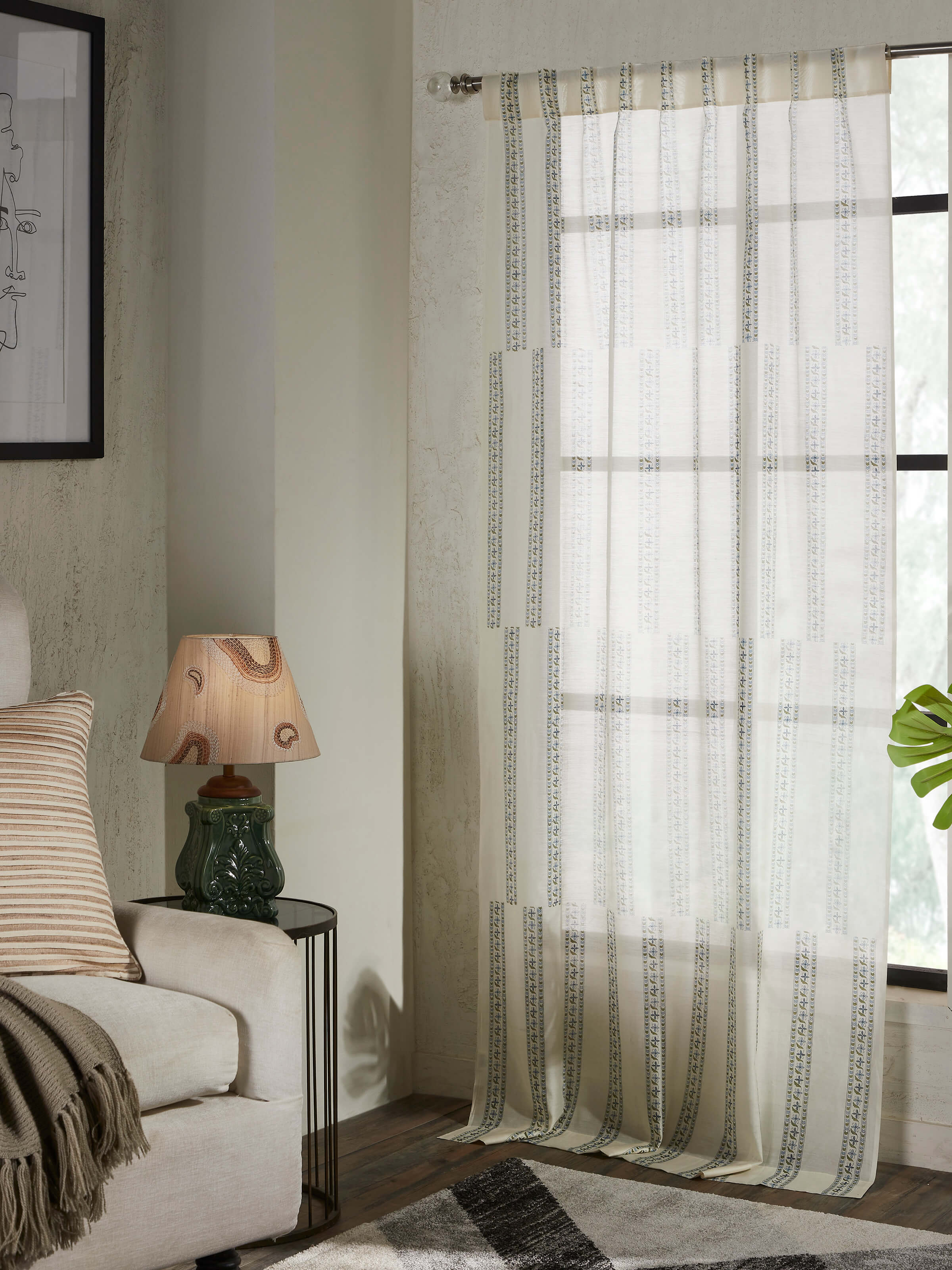 Close-up of the blue floral border on Aaarunya cotton silk Sanganeri block printed sheer curtain