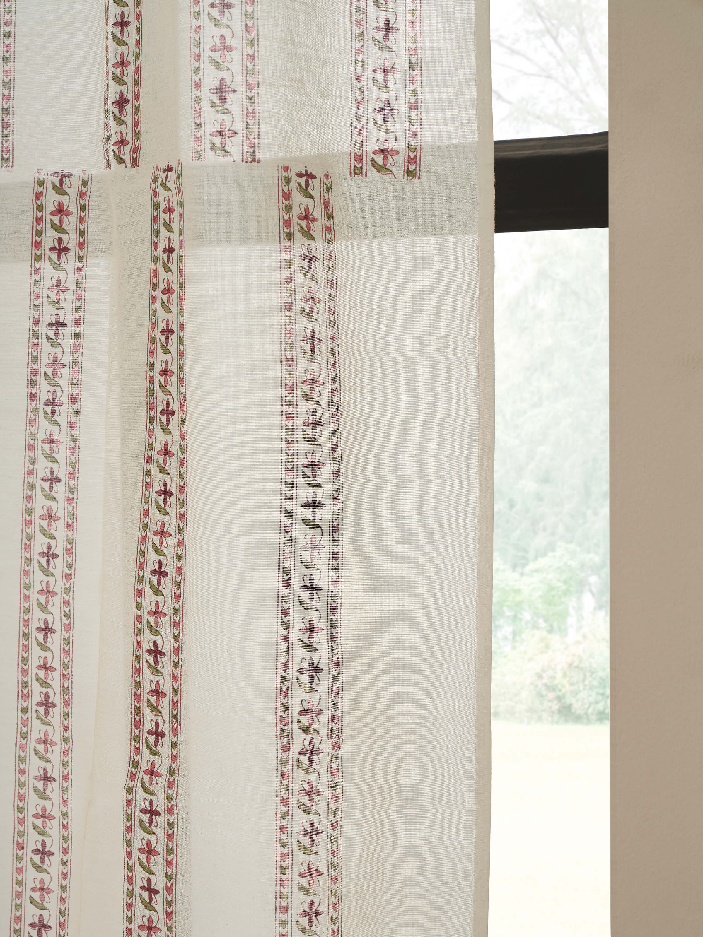 Detailed view of the red floral Sanganeri block printed sheer curtain, focusing on the texture and print of the cotton silk fabric.