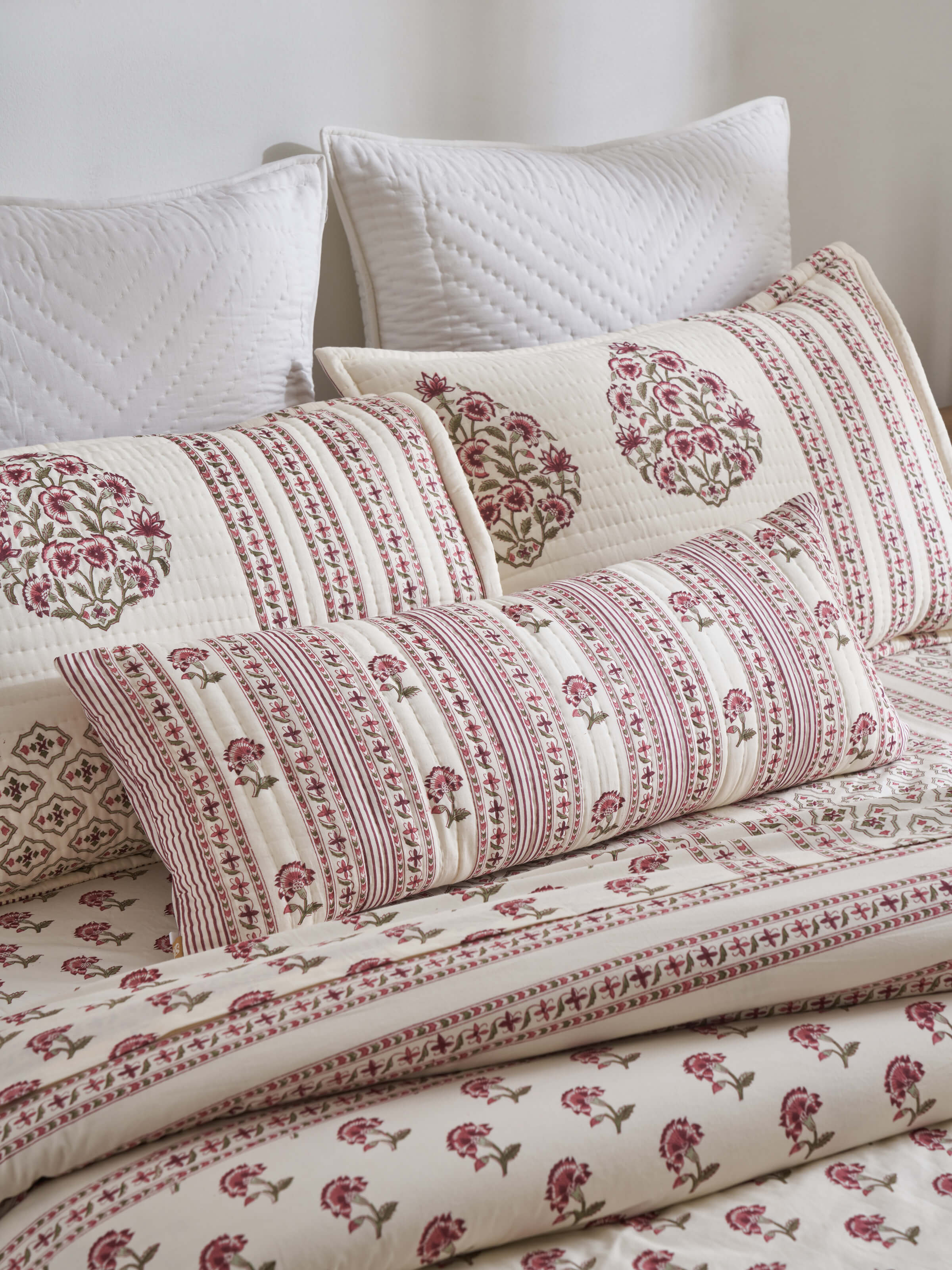 Close-up of Aaarunya red floral cotton Sanganeri block printed cushion cover showcasing the block print details