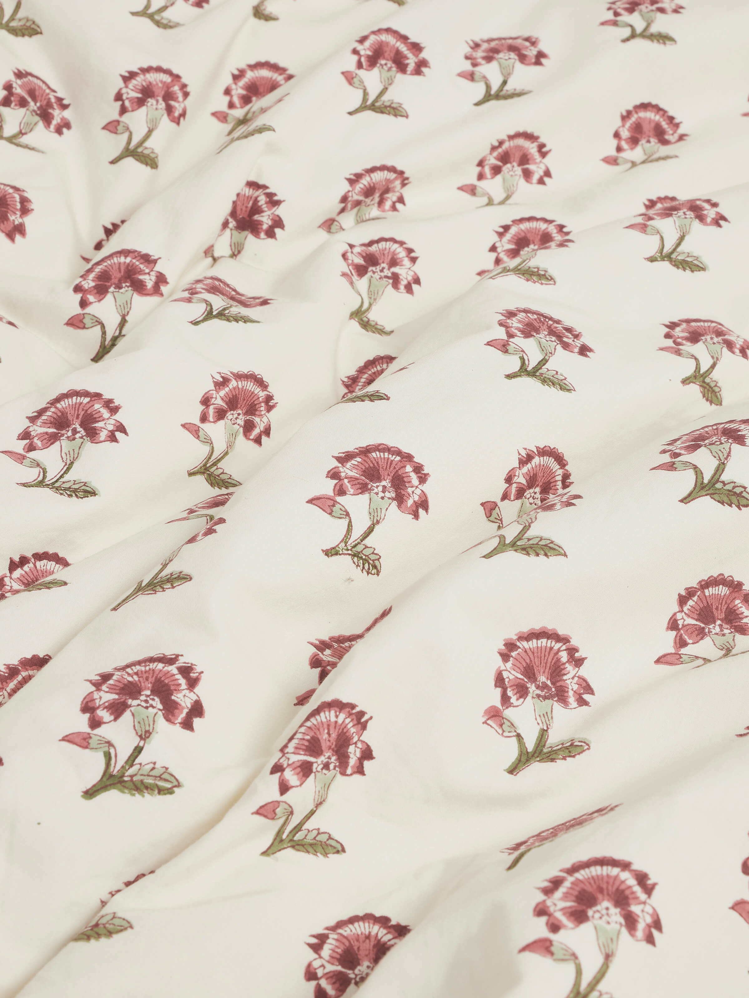 Close-up of the floral pattern on Aarunya Red Floral Cotton Sanganeri Block Printed Queen Duvet Cover showing the intricate block print details.
