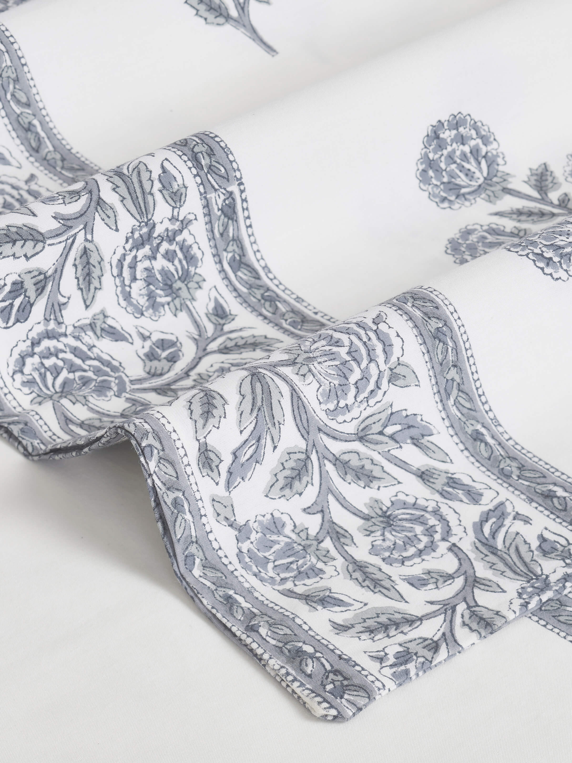 Folded view of Saha grey buta cotton Sanganeri block printed queen bedsheet set (3 pcs) displaying the overall print and fabric.