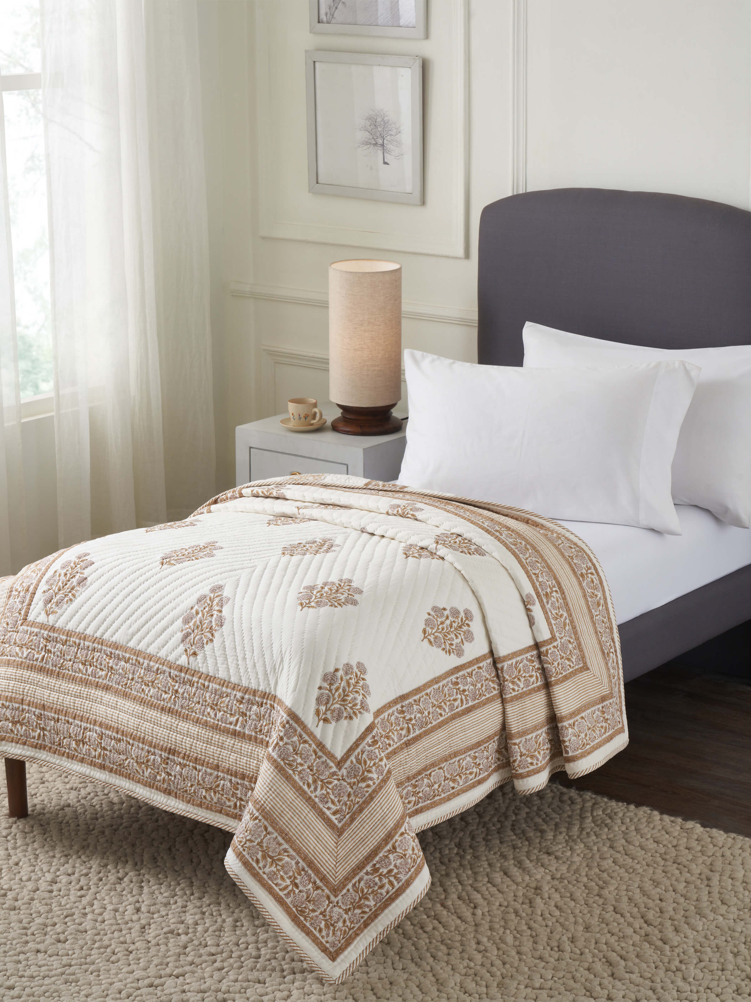 Close-up of Saha brown buta cotton Sanganeri block printed double quilt highlighting the block print details.