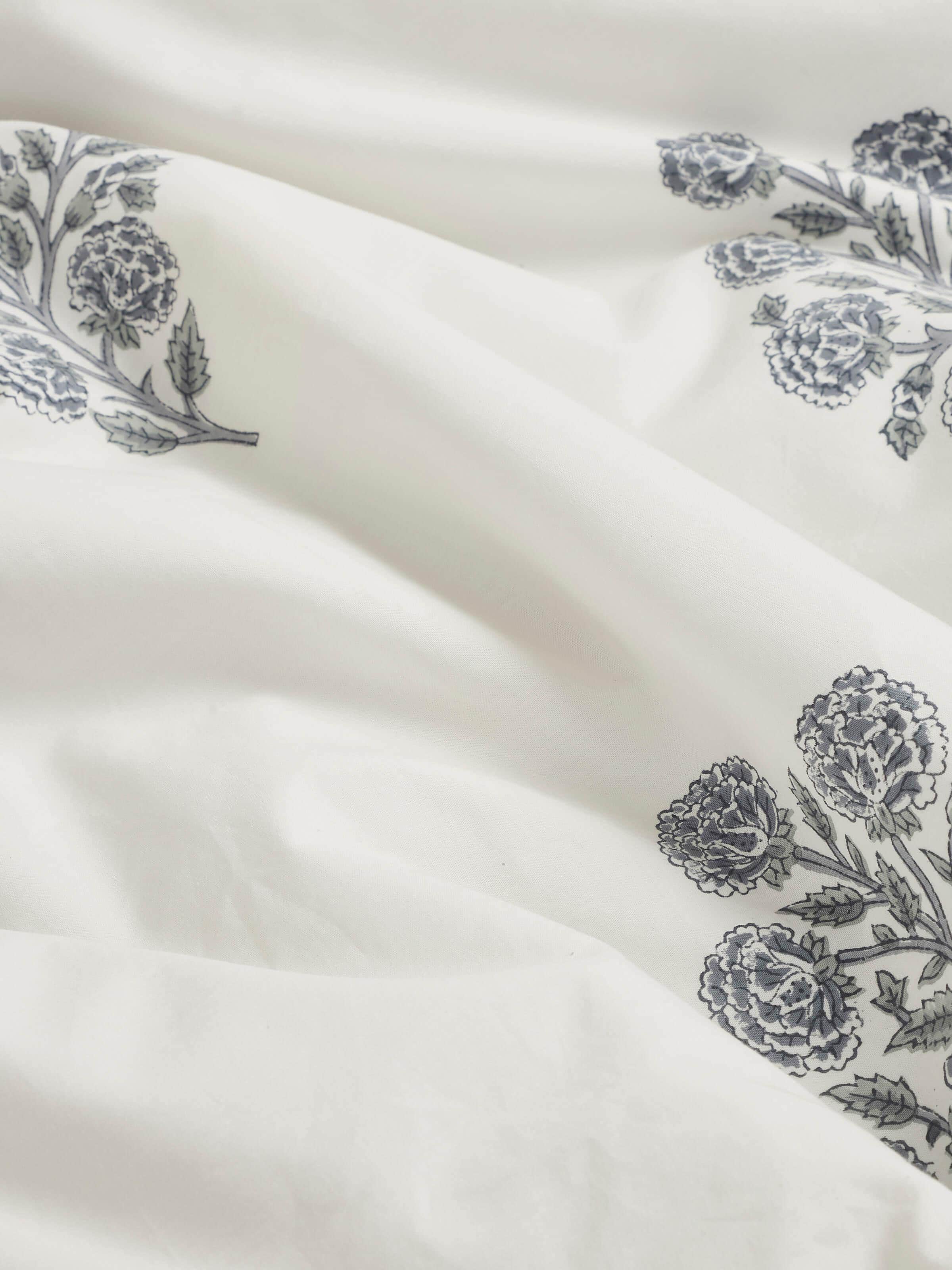 Saha grey buta stripe cotton Sanganeri block printed queen duvet cover on a bed, displaying its design and functionality.