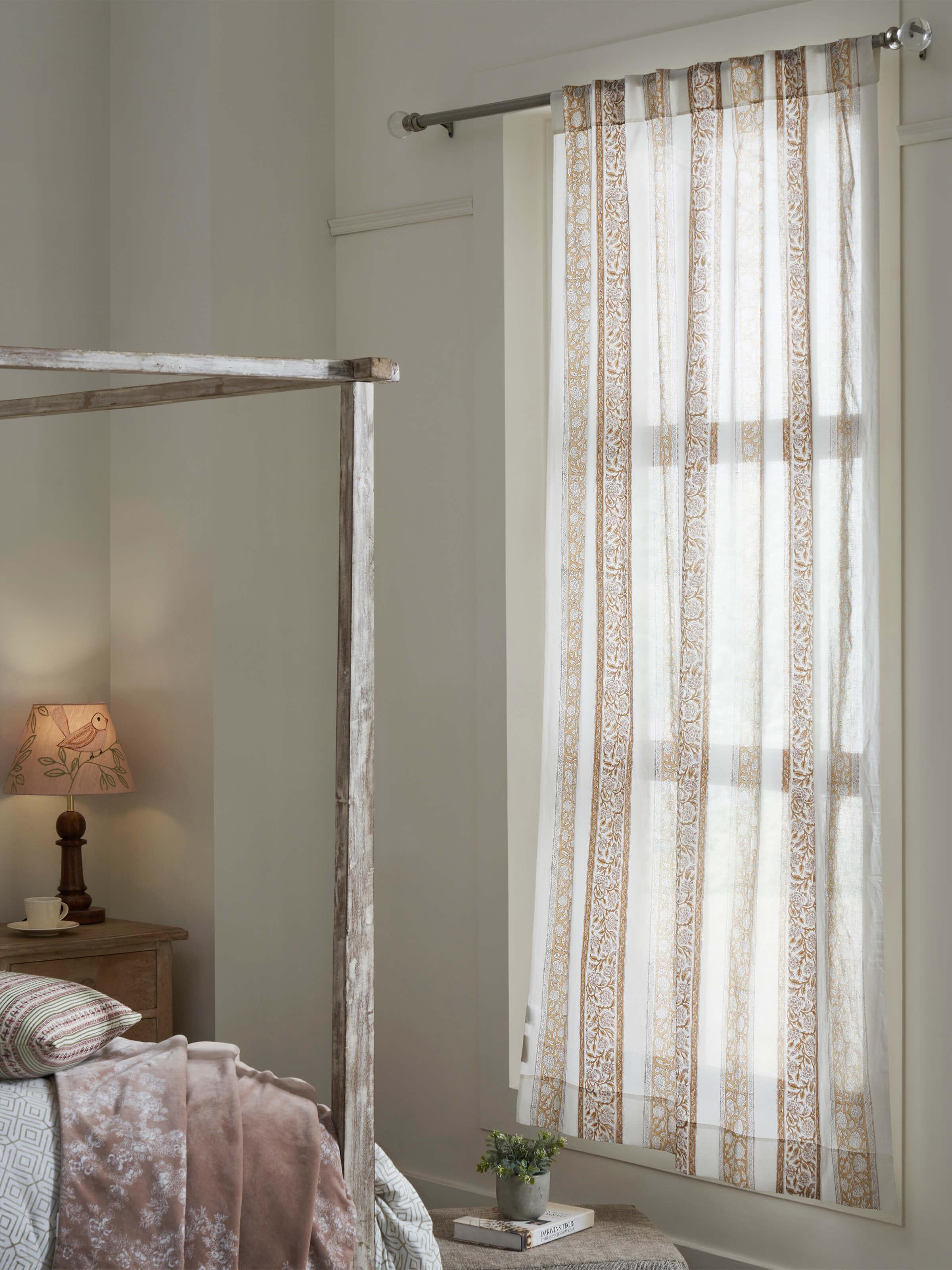 Close-up view of the Sanjhi brown floral border cotton sheer curtain, highlighting the intricate block print pattern and color.
