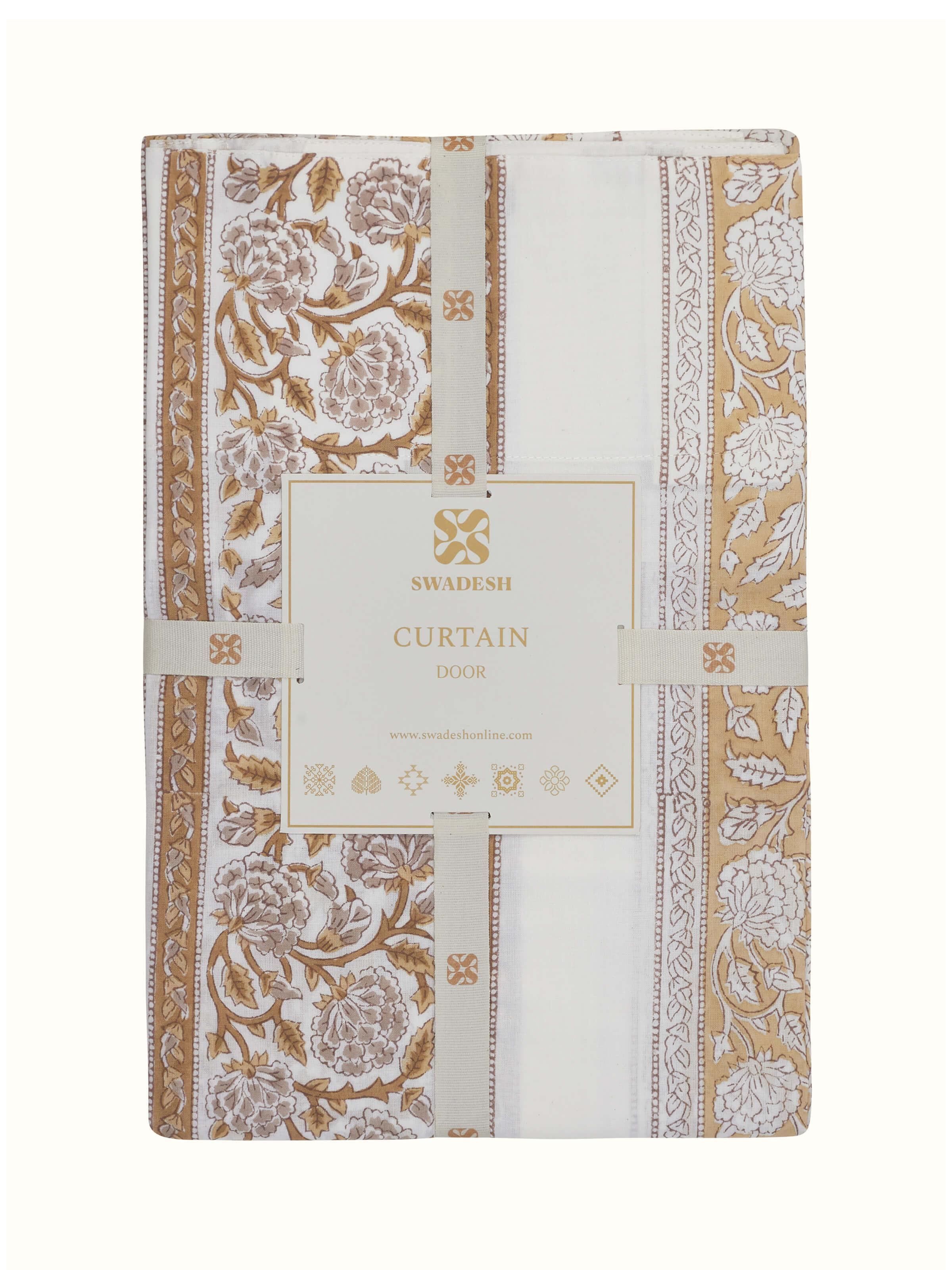 Detailed shot of the Sanjhi sheer curtain with a brown floral border, focusing on the block printing and fabric texture.