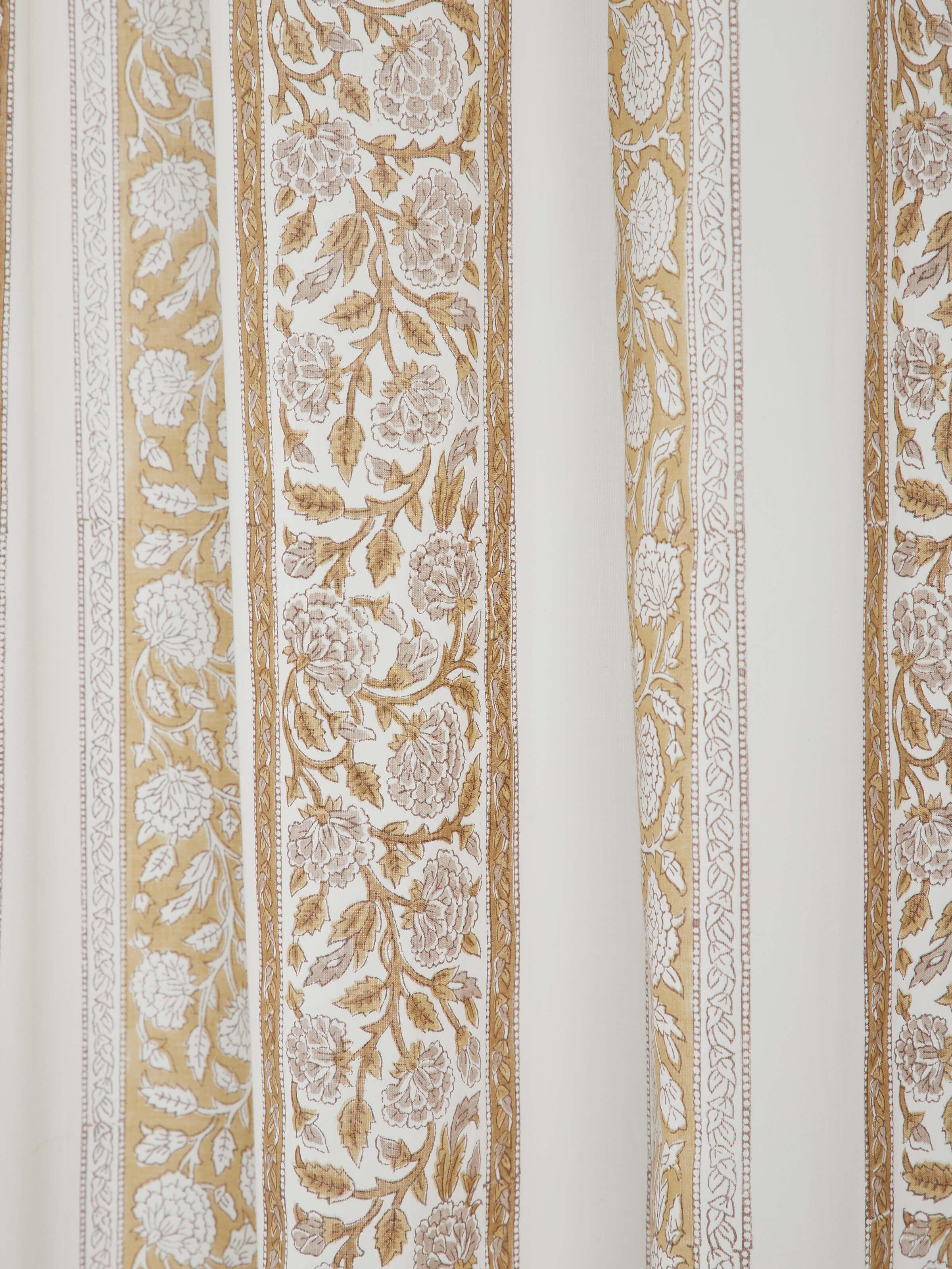 Full view of the Sanjhi sheer curtain, illustrating its flowy design and delicate floral border in a home setting.
