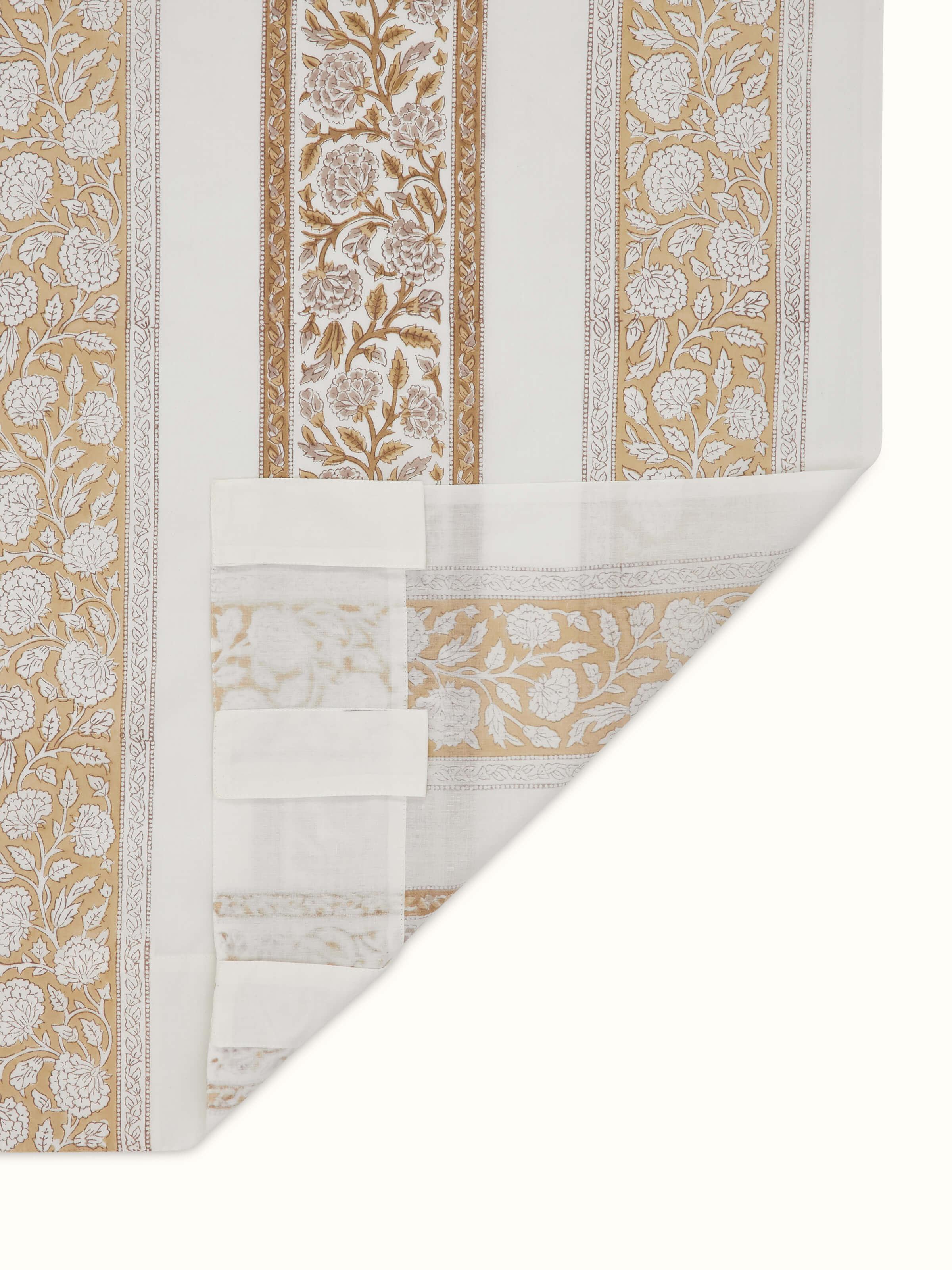 Sanjhi brown floral border sheer curtain hanging, demonstrating its elegant draping and sheer quality.