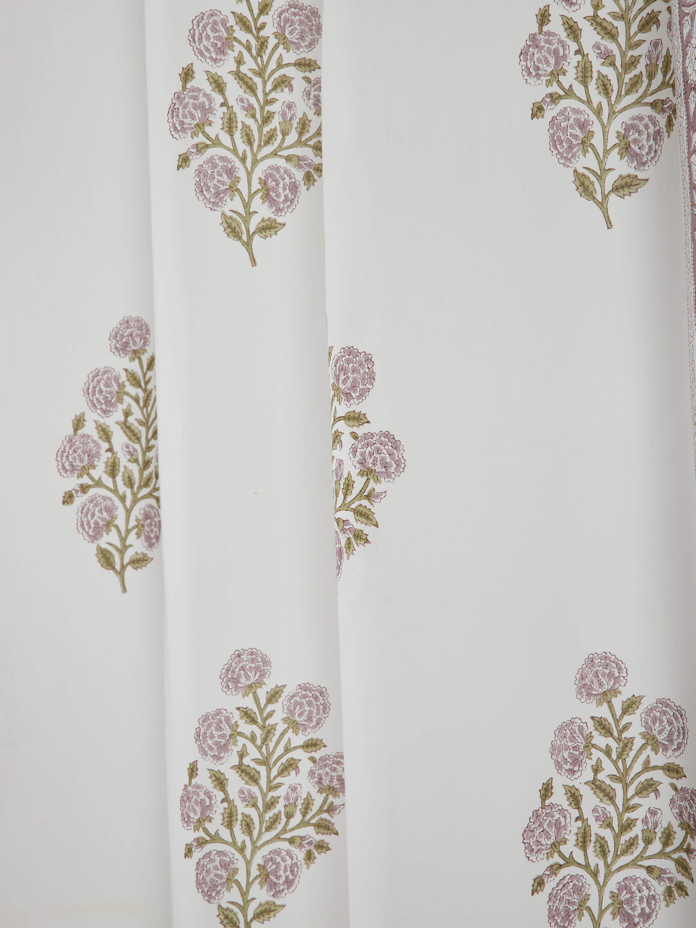 Close-up of light purple floral Sanganeri block printed sheer curtain, showing the texture and print detail.