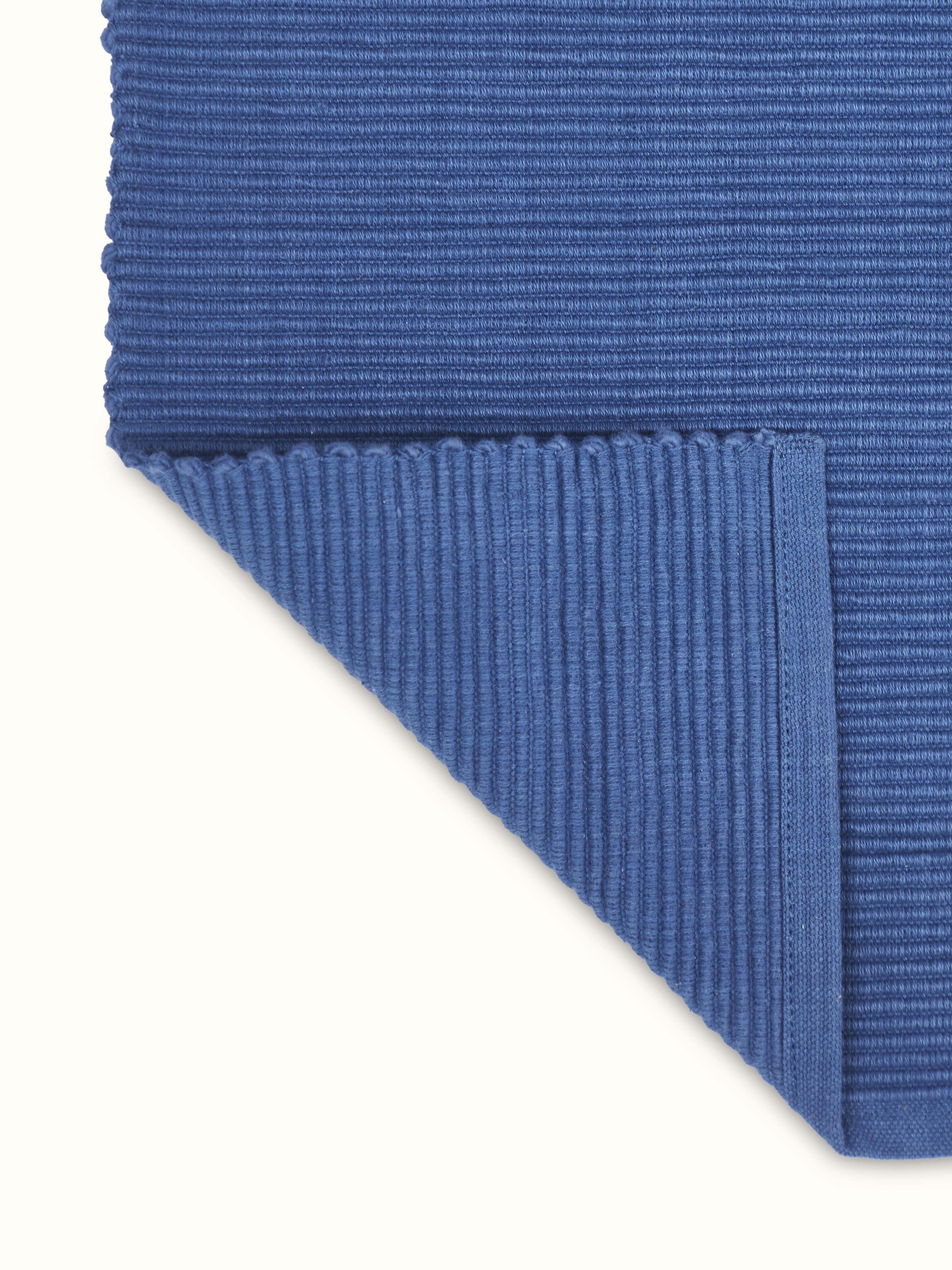 Back view of the runner illustrating neat stitching and solid handloom fabric.