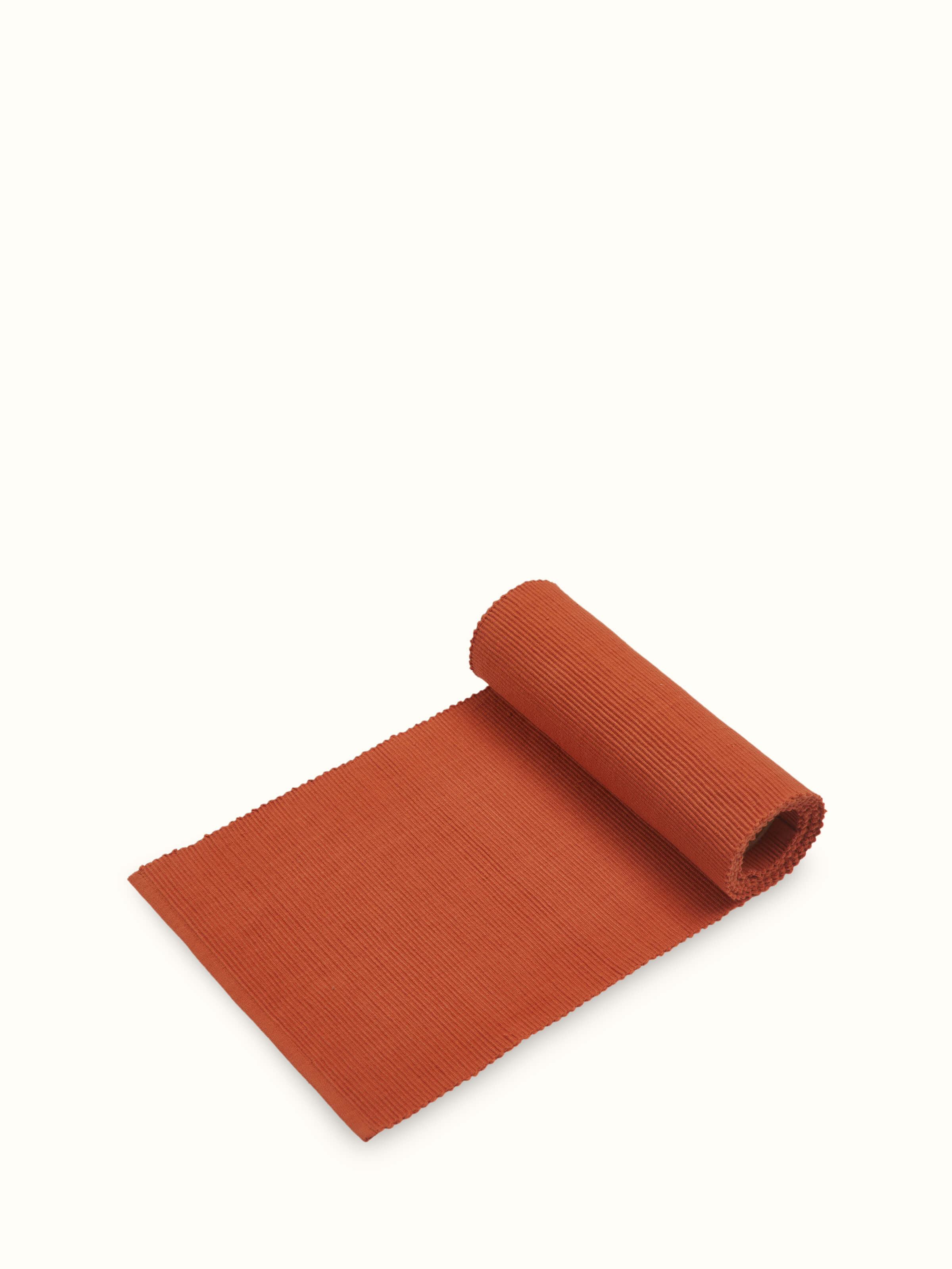 Angled aesthetic view of Vastav Cotton Handloom Table Runner, capturing rich color and weave.