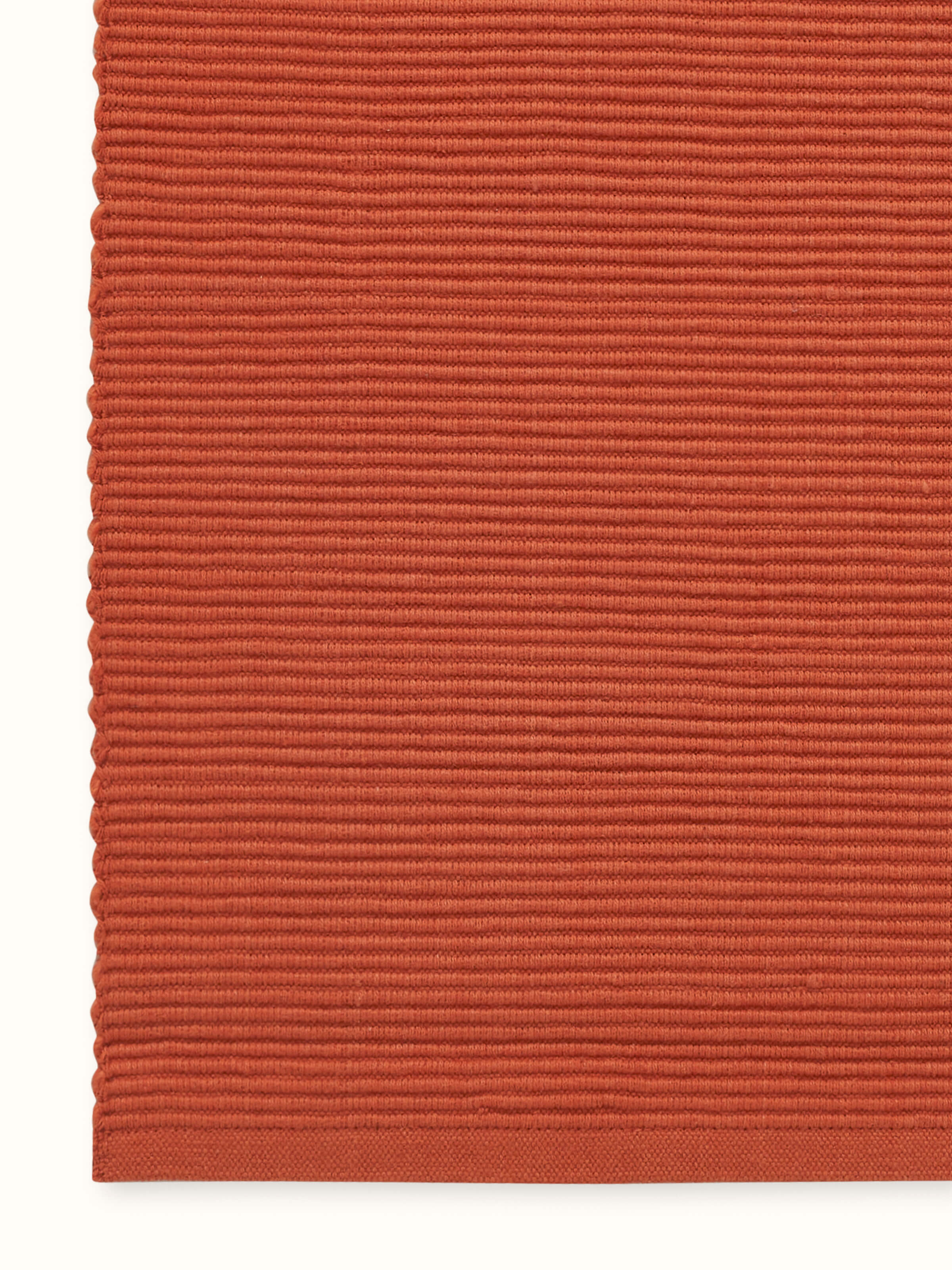 Close-up detail of Vastav Rust Runner, showcasing texture of handloom cotton.