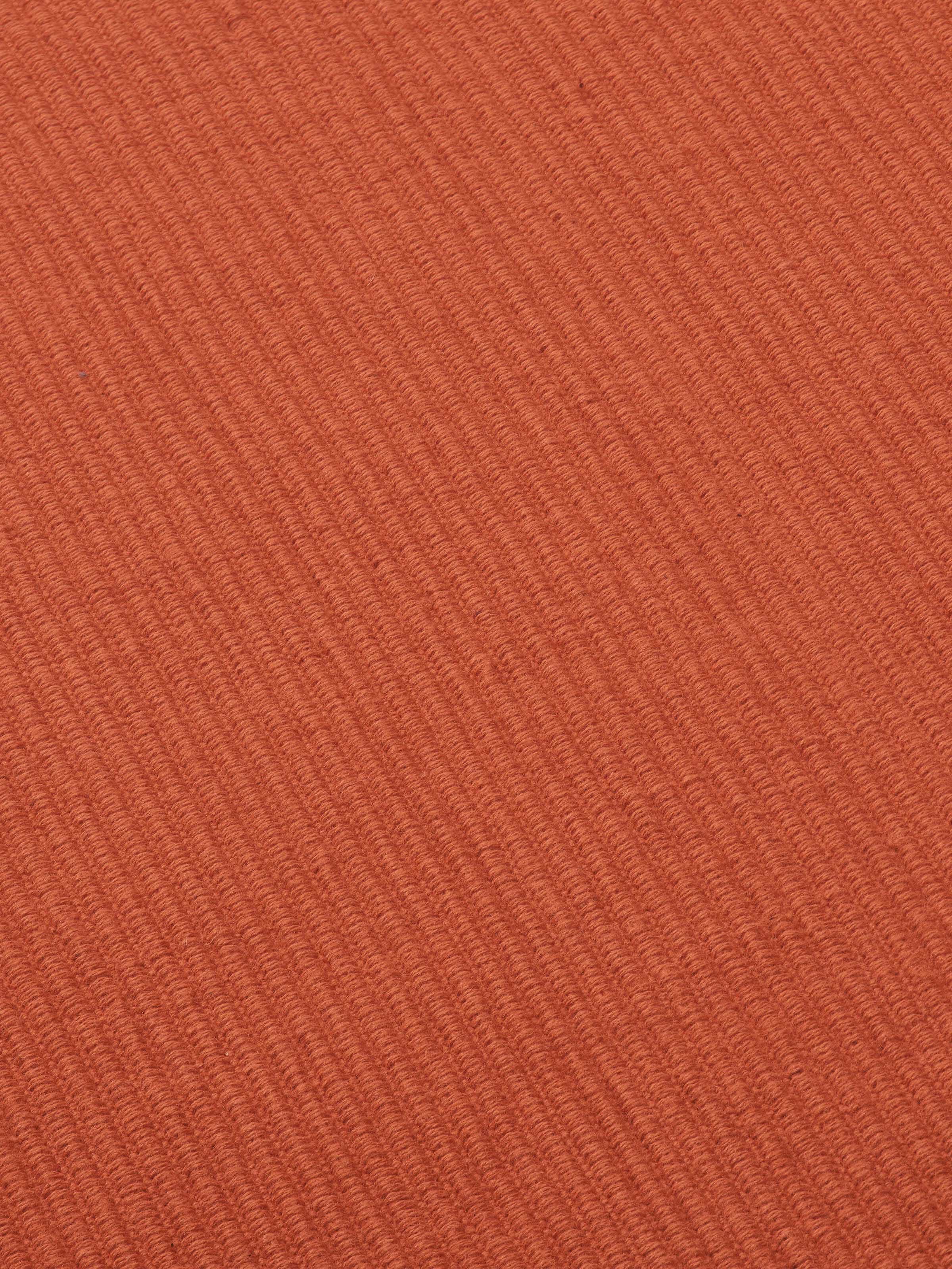 Side view of Vastav Table Runner fabric, emphasizing thickness and neat hem.