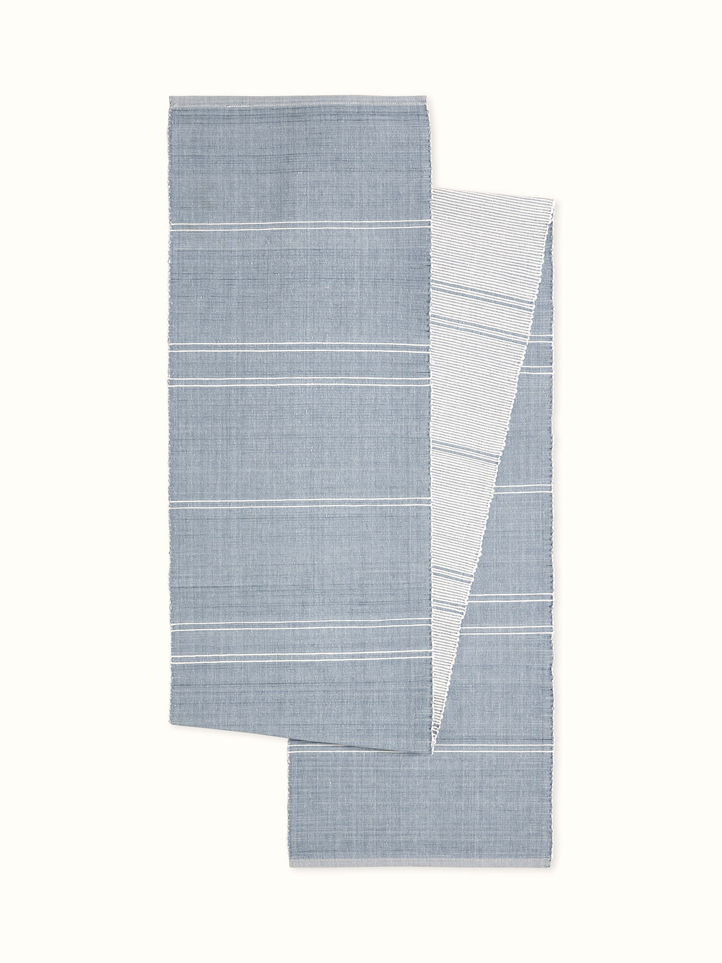 Front view: Front view of Vastav cotton handloom table runner in light blue stripes for 6-seater dining table.
