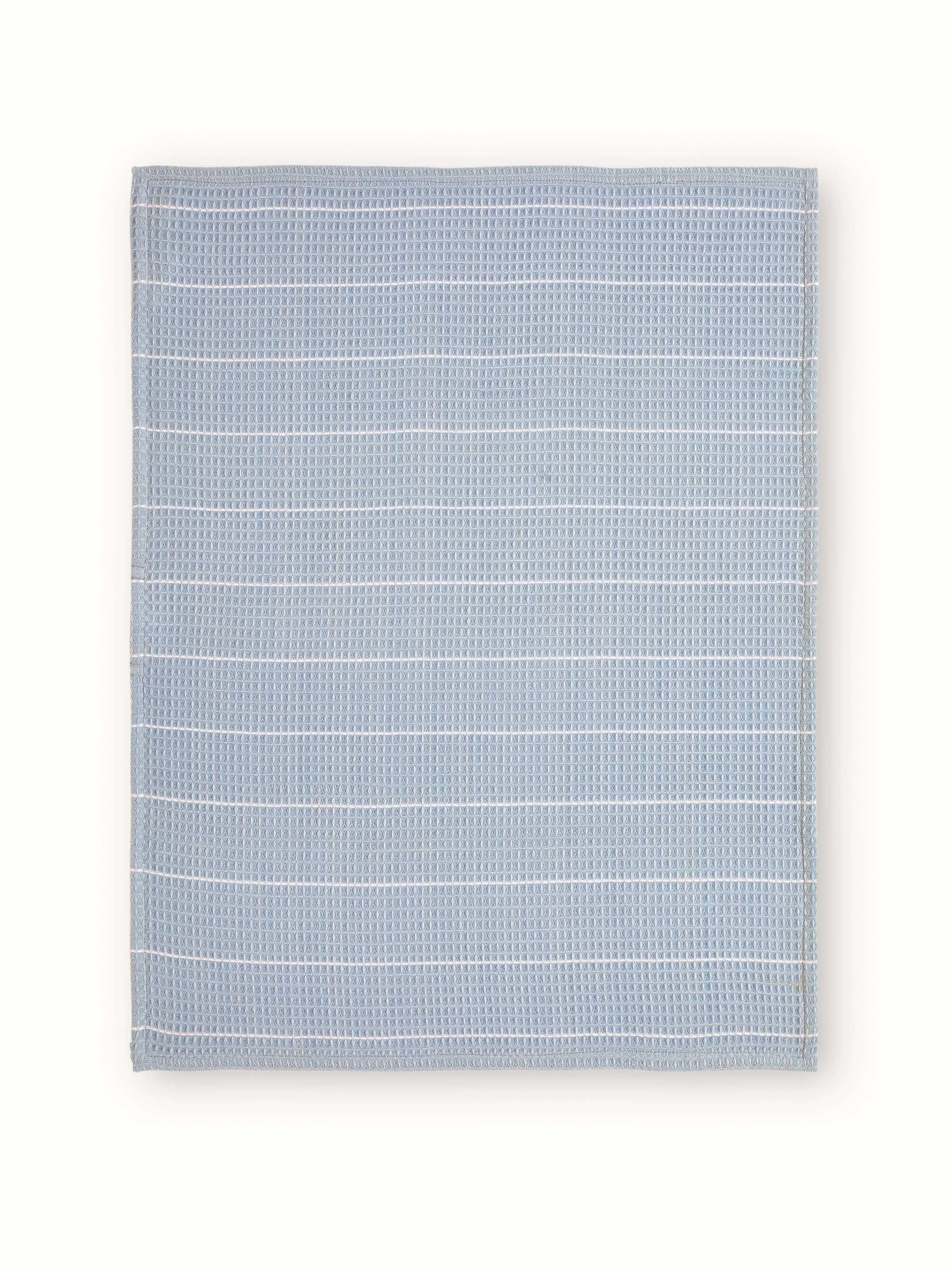 Arth Light Blue Waffle Cotton Dish Towels (4 pcs) - A close-up of folded dish towels showing the texture and color.
