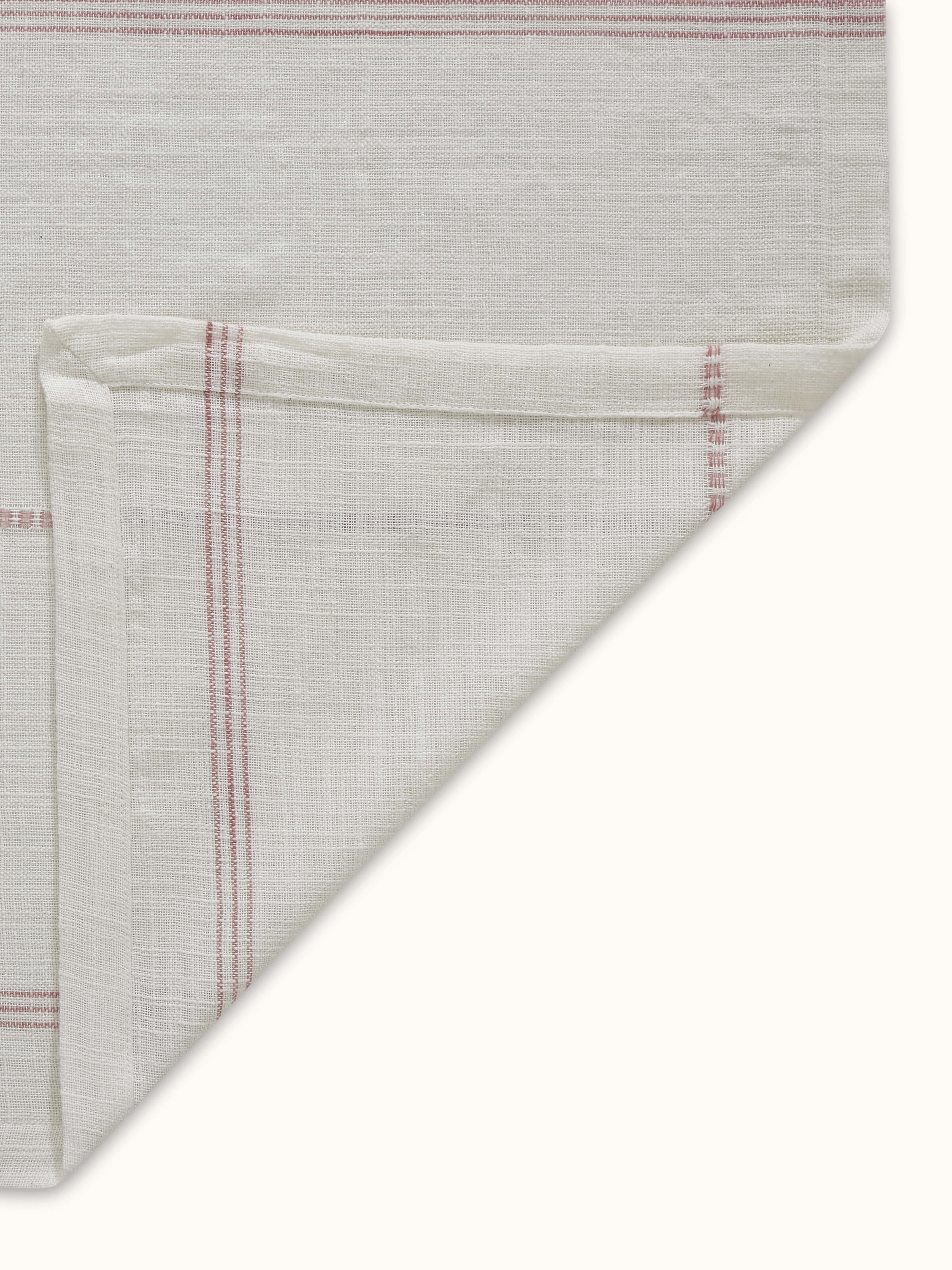 Arth pink stripe cotton table cover (4 seater) styled on a table to show its fit and coverage