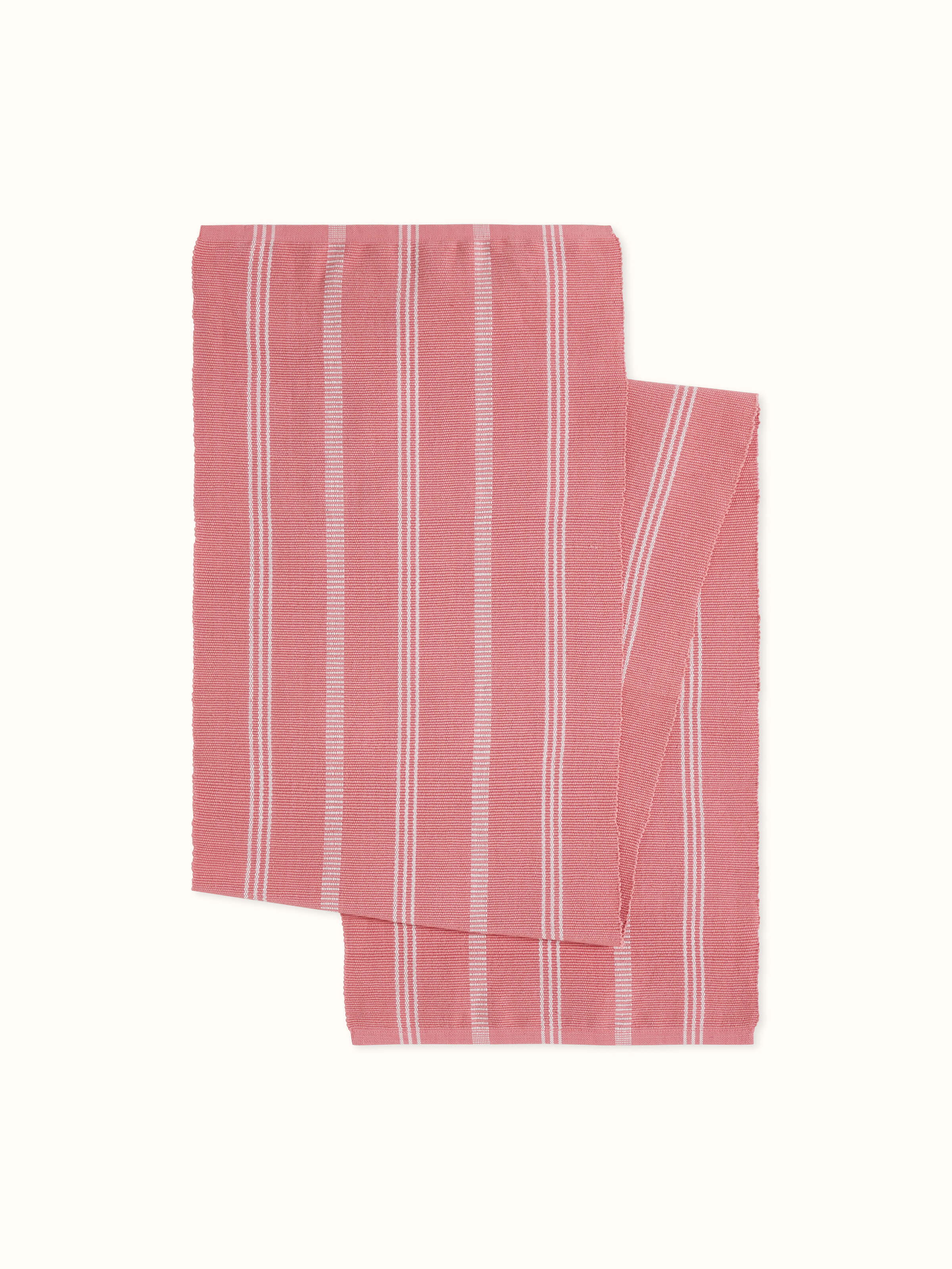 A full front view of the Vastav Pink Stripe Cotton Handloom Table Runner designed for a four-seater dining table, showcasing the handcrafted pink striped pattern and woven texture by Swadesh.