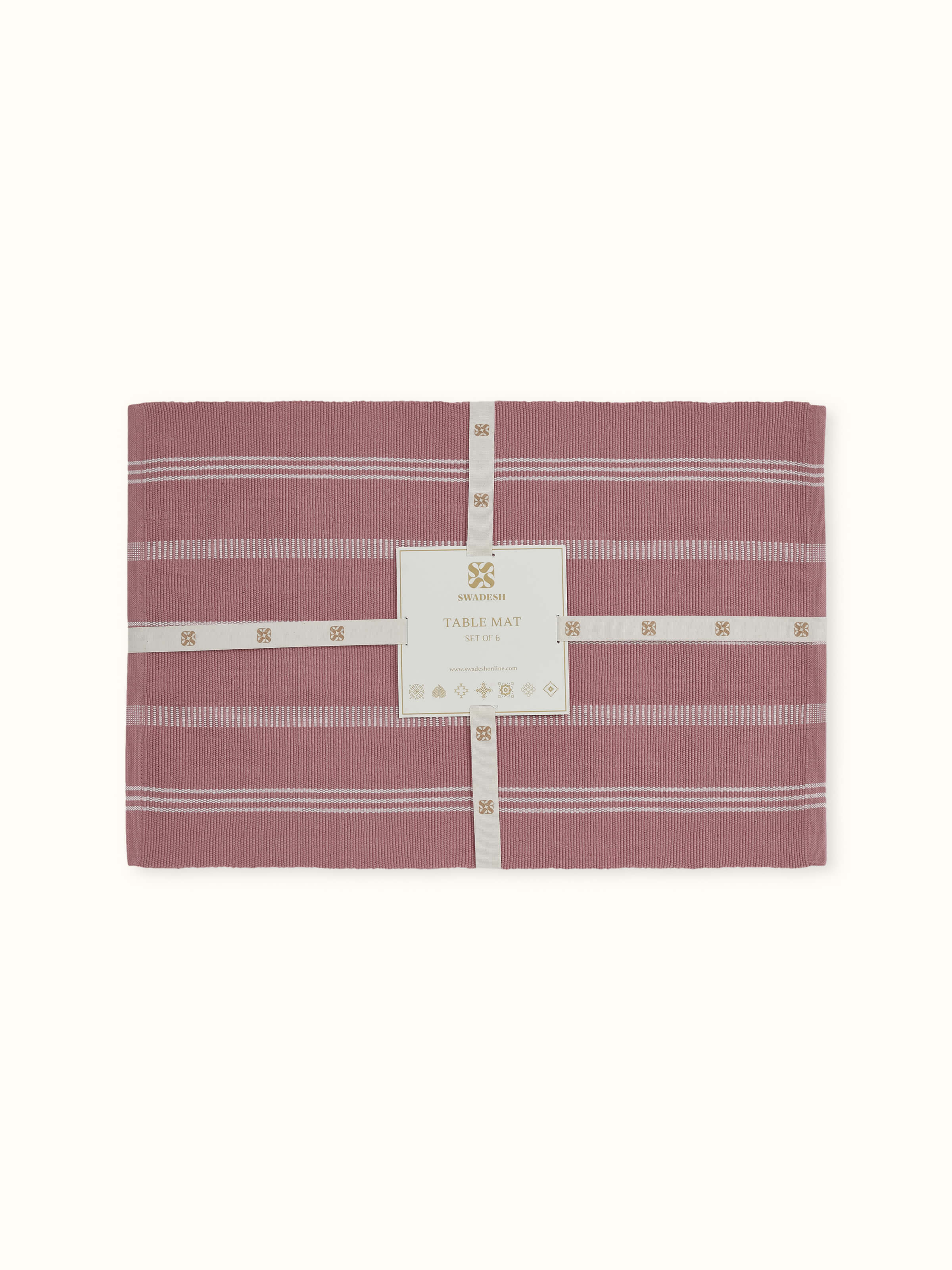 Close-up showing stripe detail and weave of Vastav pink cotton table mat
