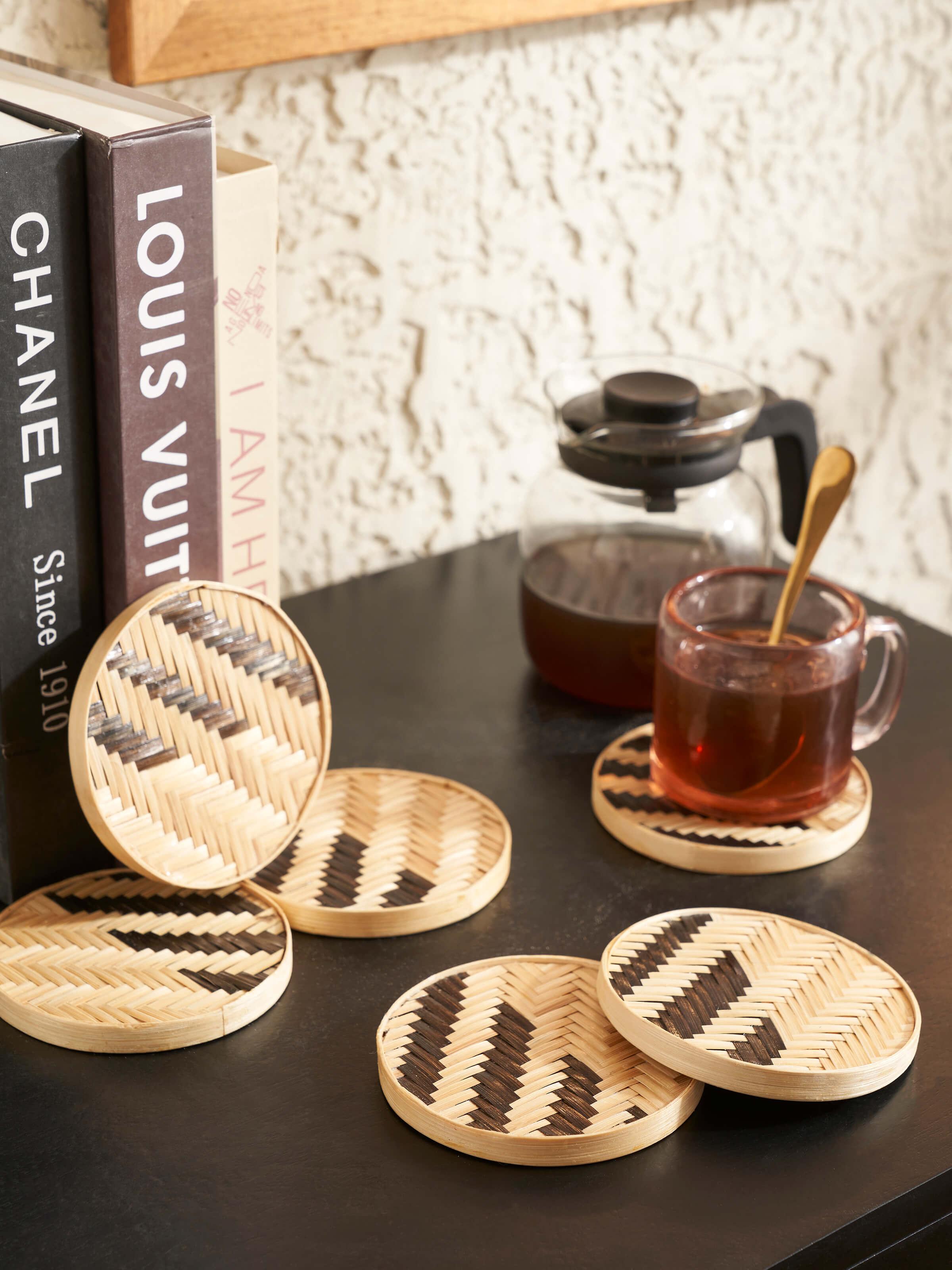Close-up of Naveena Grey Checks Round Natural Fibre Coasters, highlighting the texture and checkered design of the coasters.