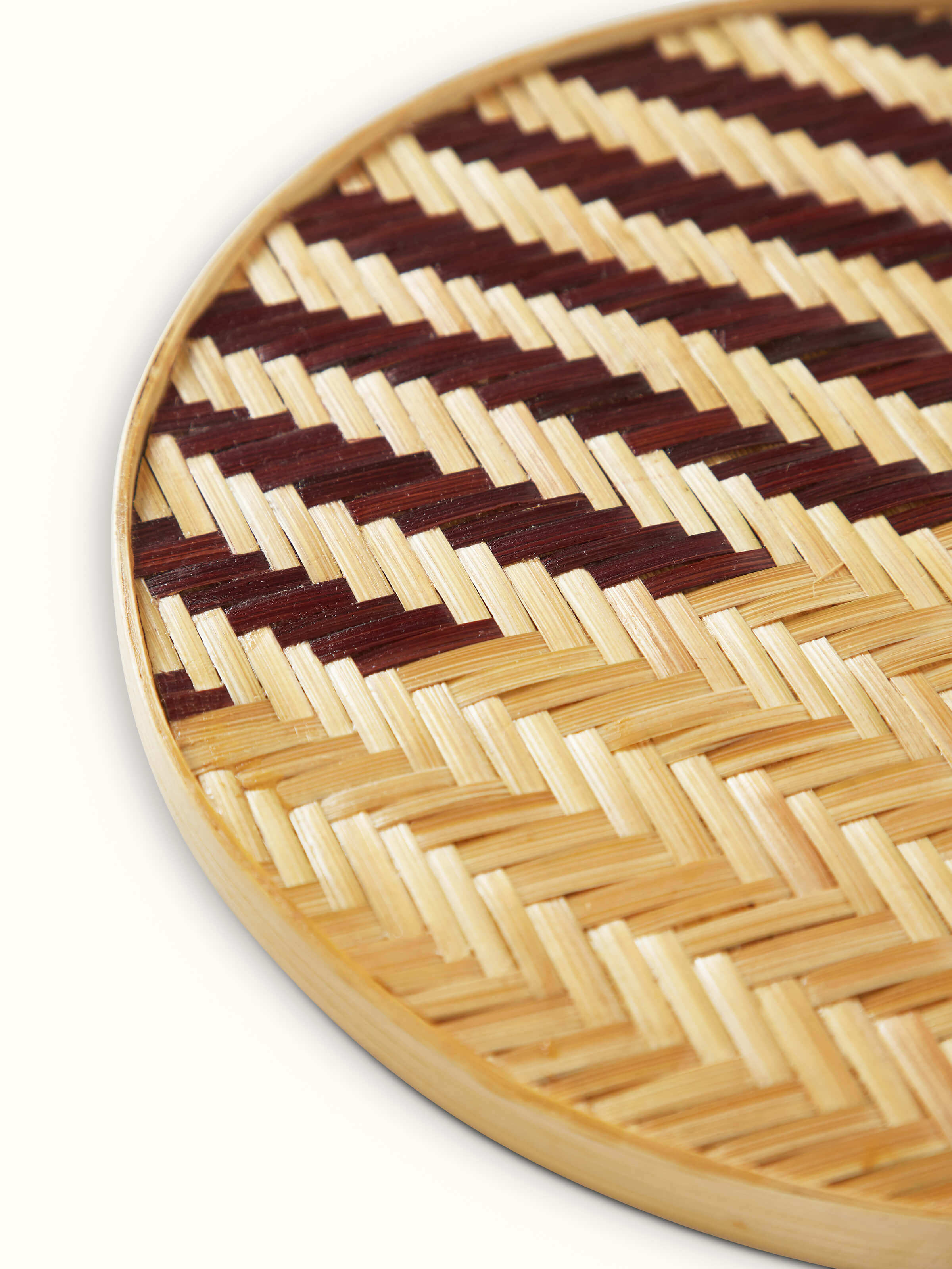 Naveena brown geometric round natural fibre trivet (2 pcs), showing the set of two trivets arranged together