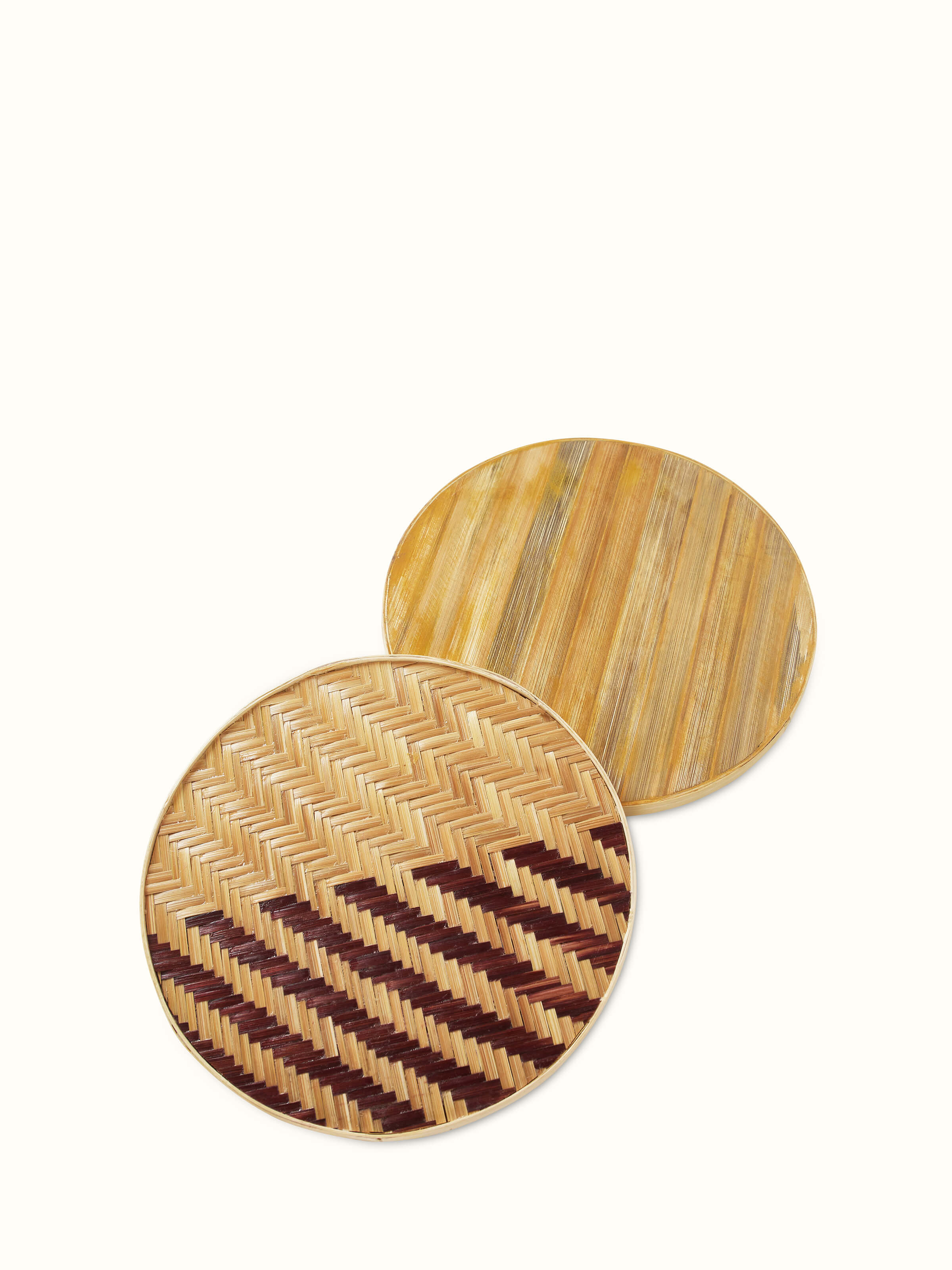 Naveena brown geometric round natural fibre trivet, detailed view of the trivet's surface and texture
