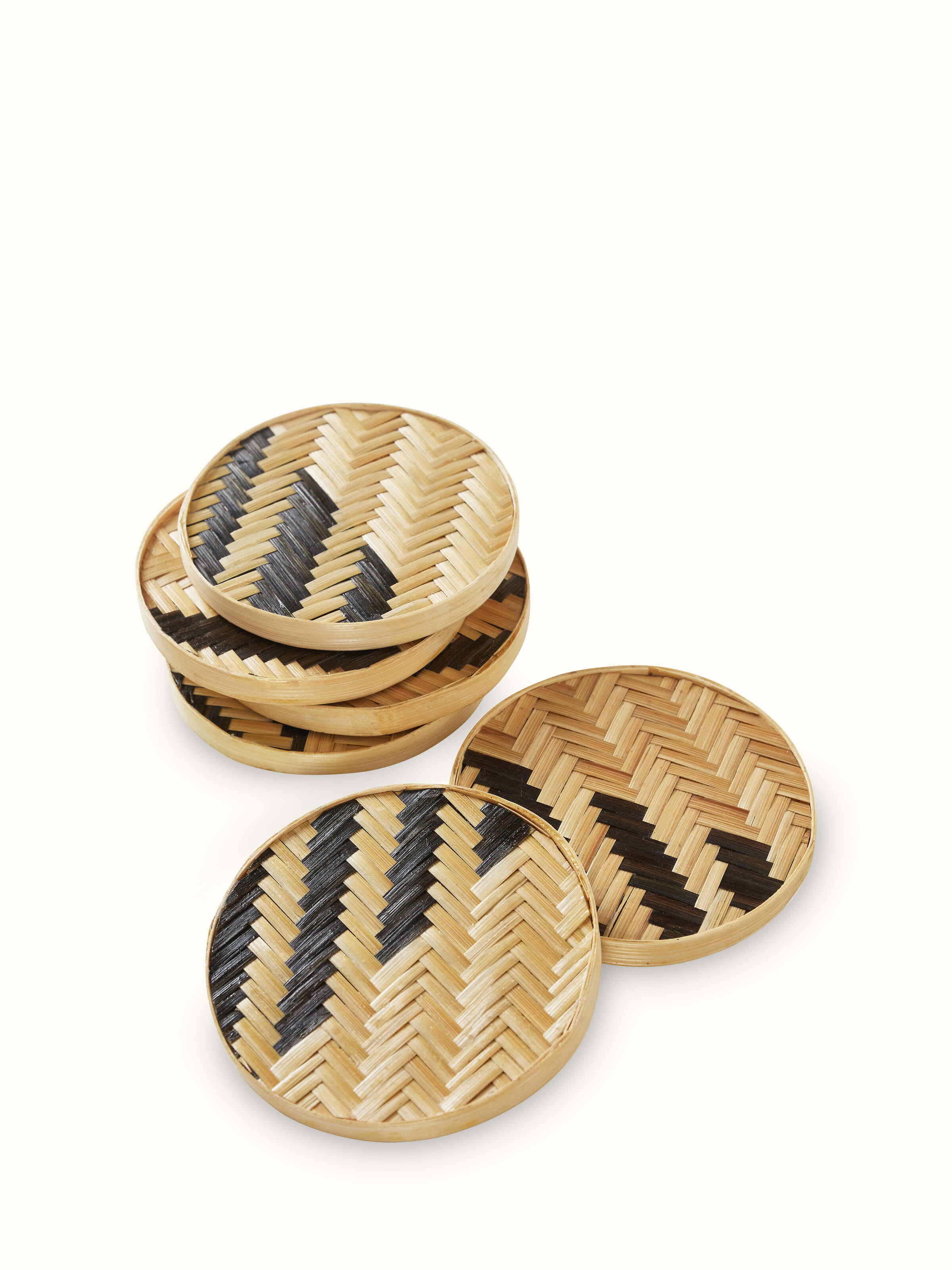 Front view of Naveena brown geometric round natural fibre coasters (6 pcs) featuring a round design with a geometric pattern.