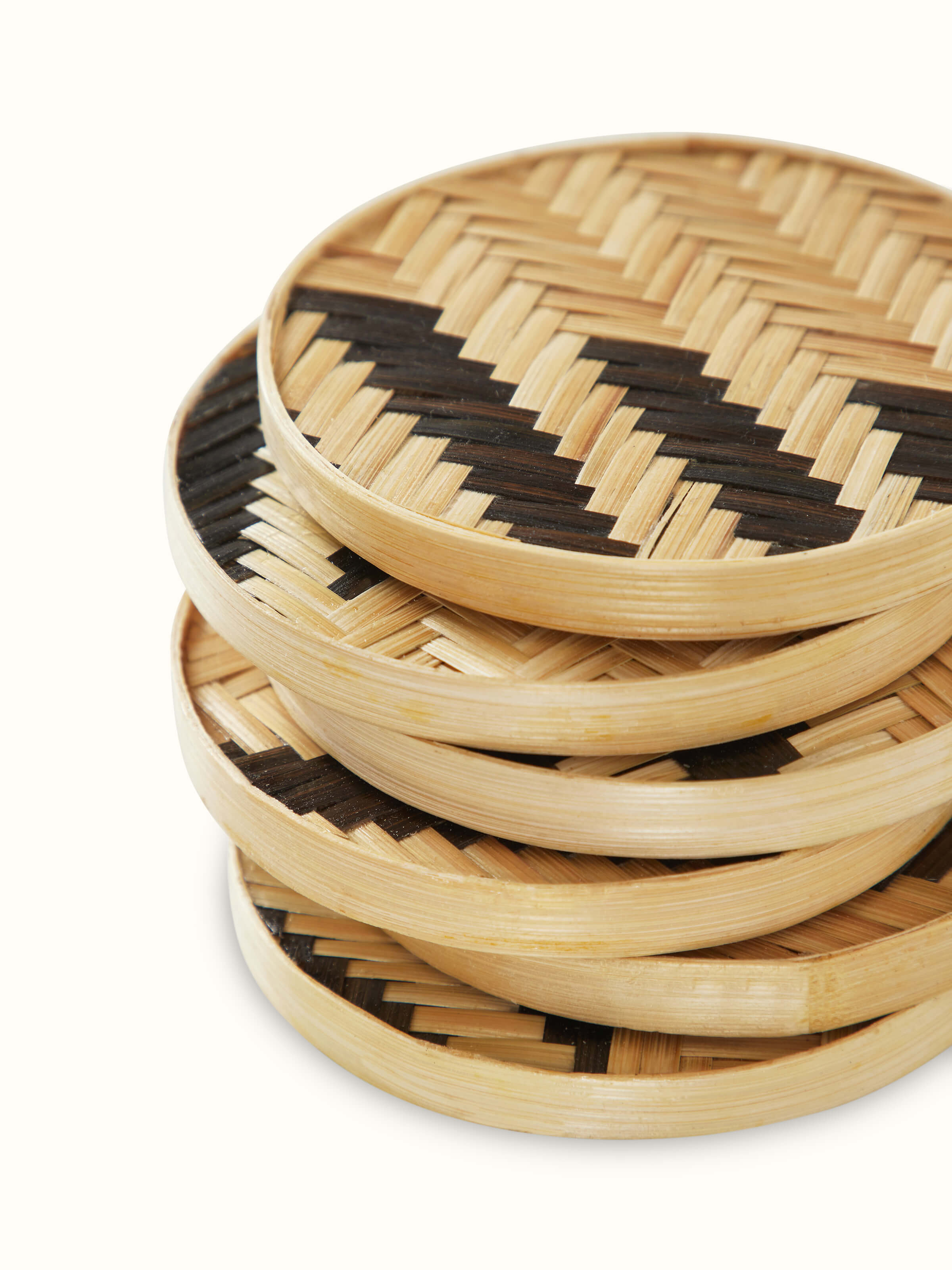 Close-up view of Naveena brown geometric round natural fibre coasters (6 pcs) showcasing the texture and geometric details.