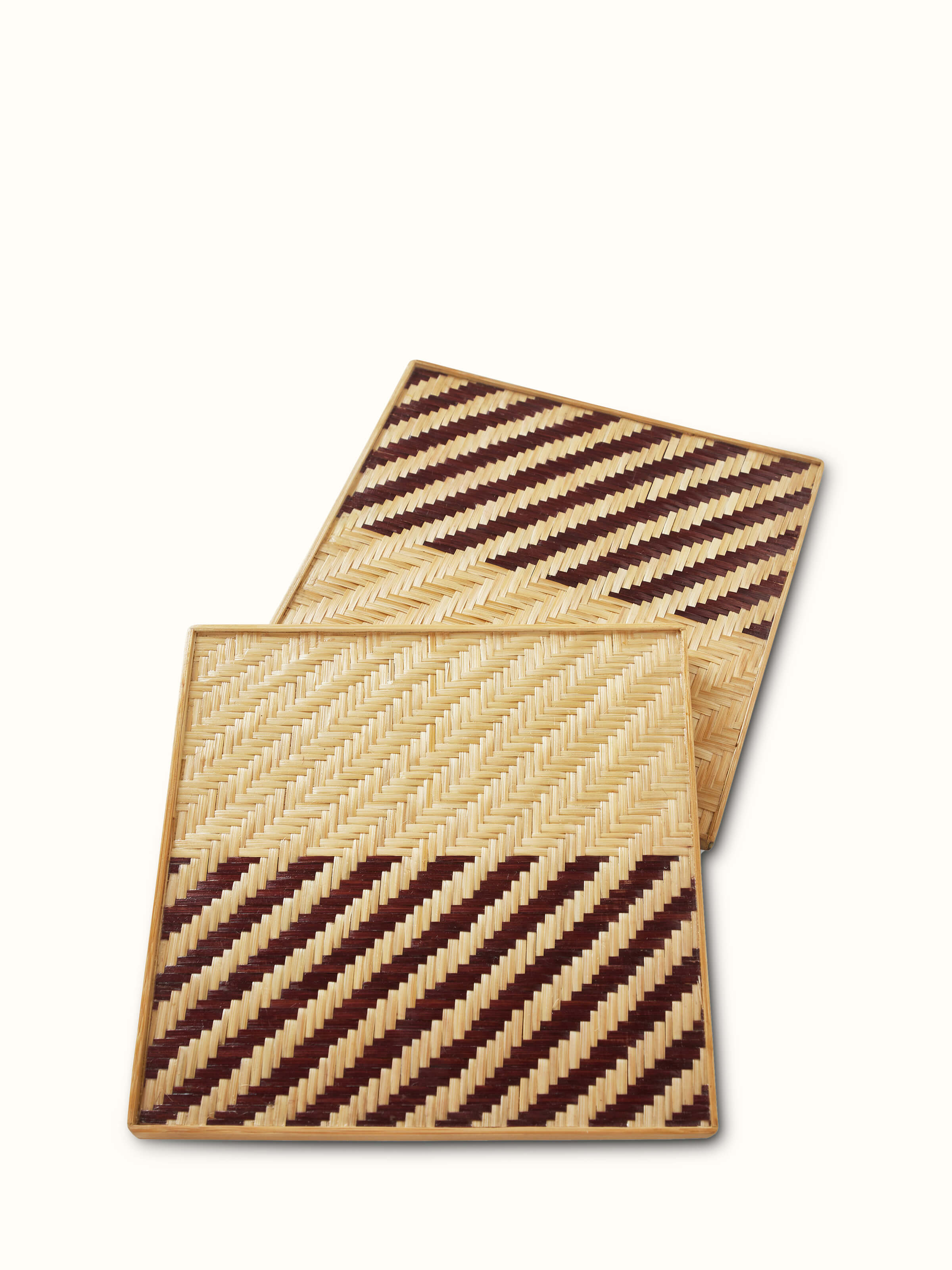 Front view of Naveena brown geometric square natural fibre trivets (2 pcs) featuring a geometric pattern in earthy brown tones.