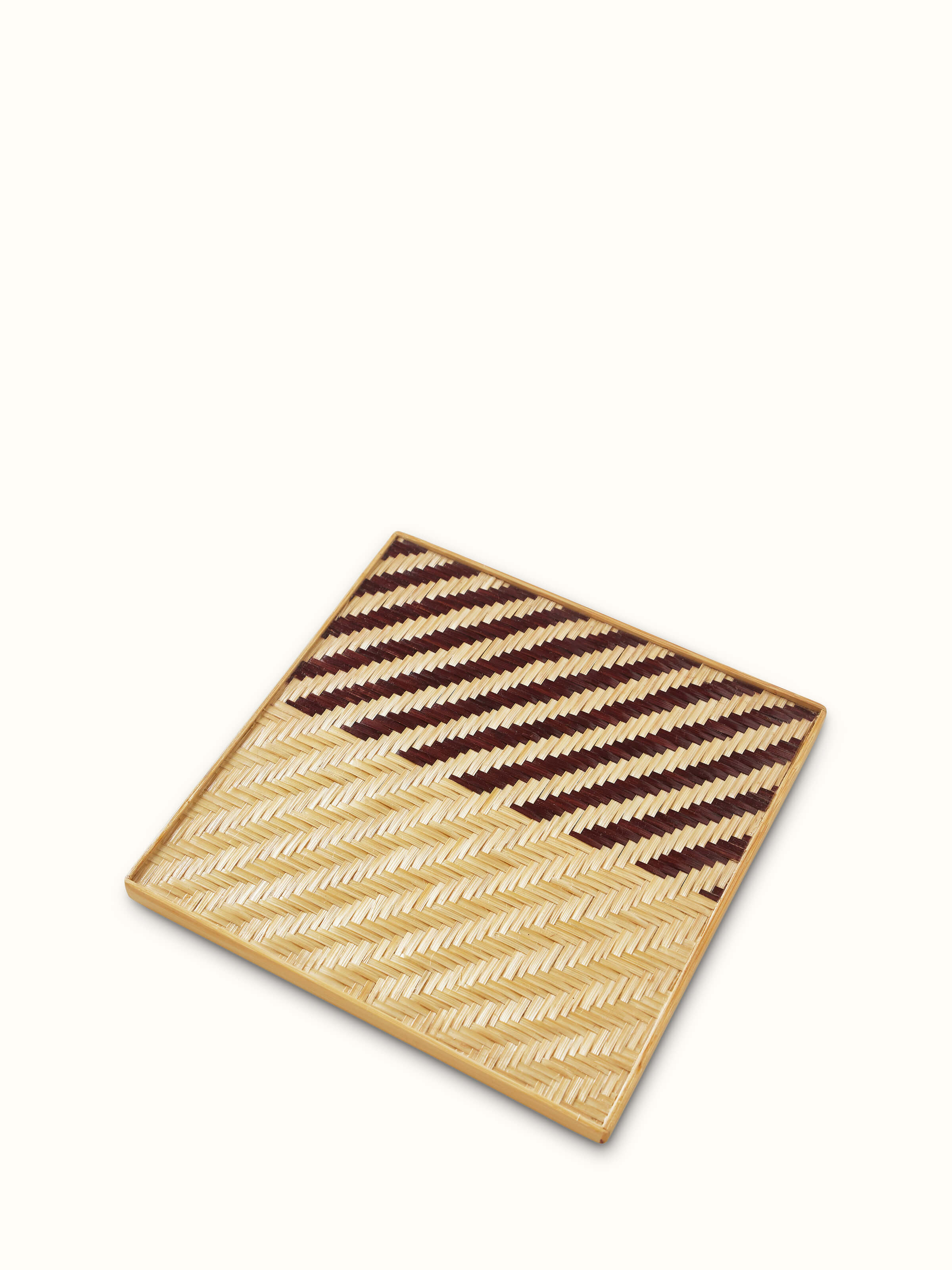 Detailed view of Naveena brown geometric square natural fibre trivets (2 pcs) highlighting the intricate geometric pattern and texture.
