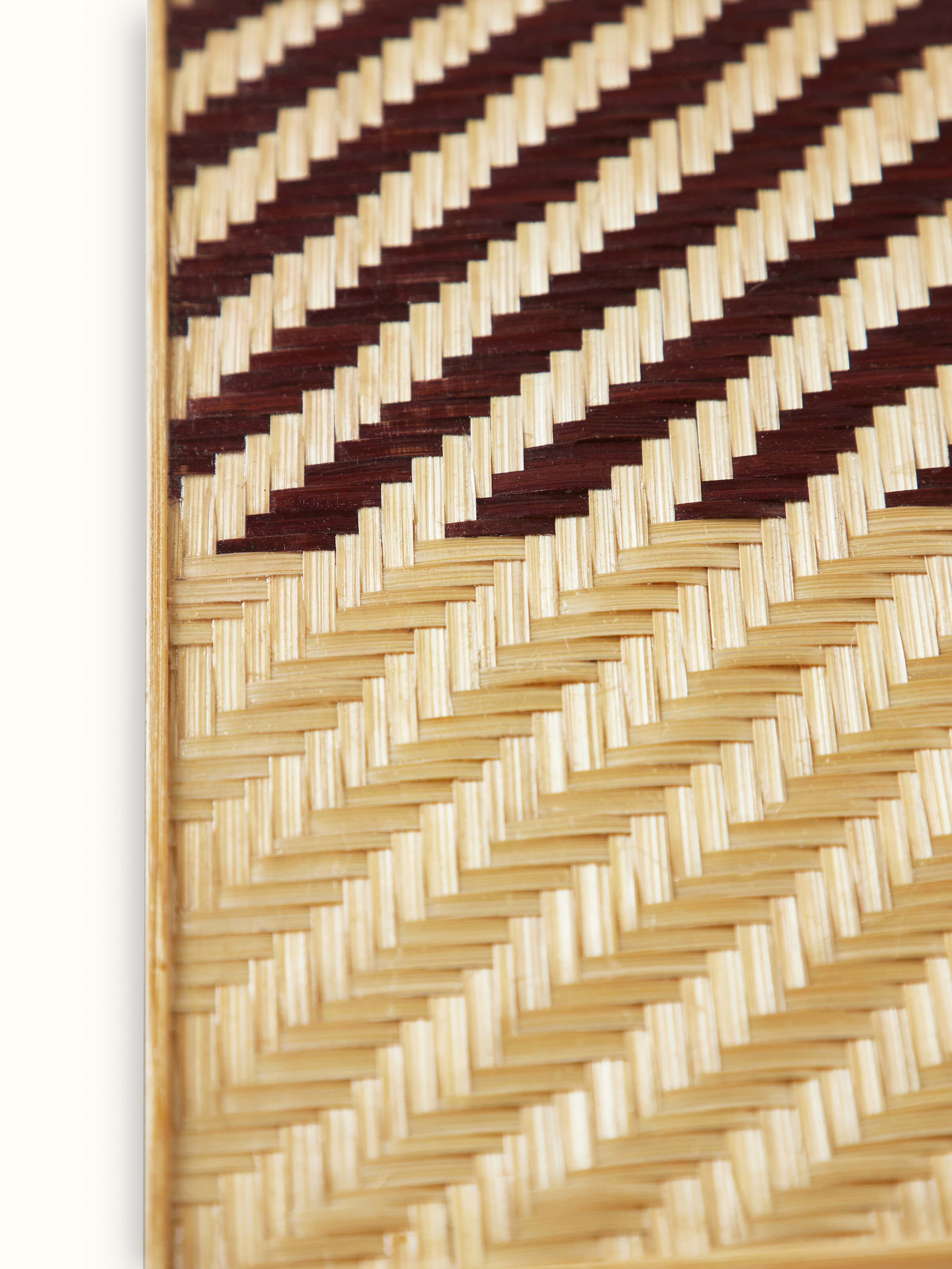 Folded view of Naveena brown geometric square natural fibre trivets (2 pcs) emphasizing the compact design and geometric details.