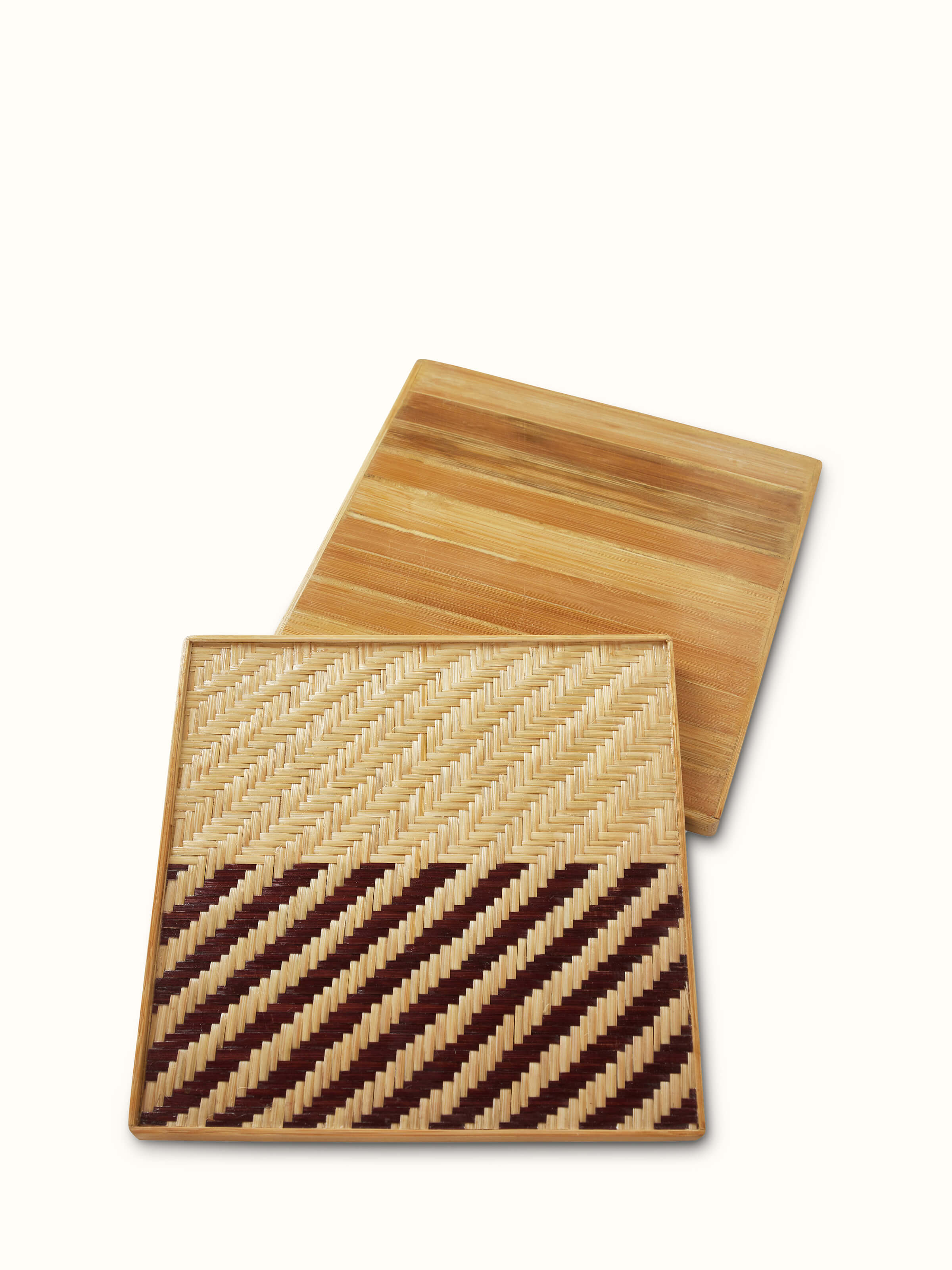 Close-up view of Naveena brown geometric square natural fibre trivets (2 pcs) showcasing the texture and natural fibre material.