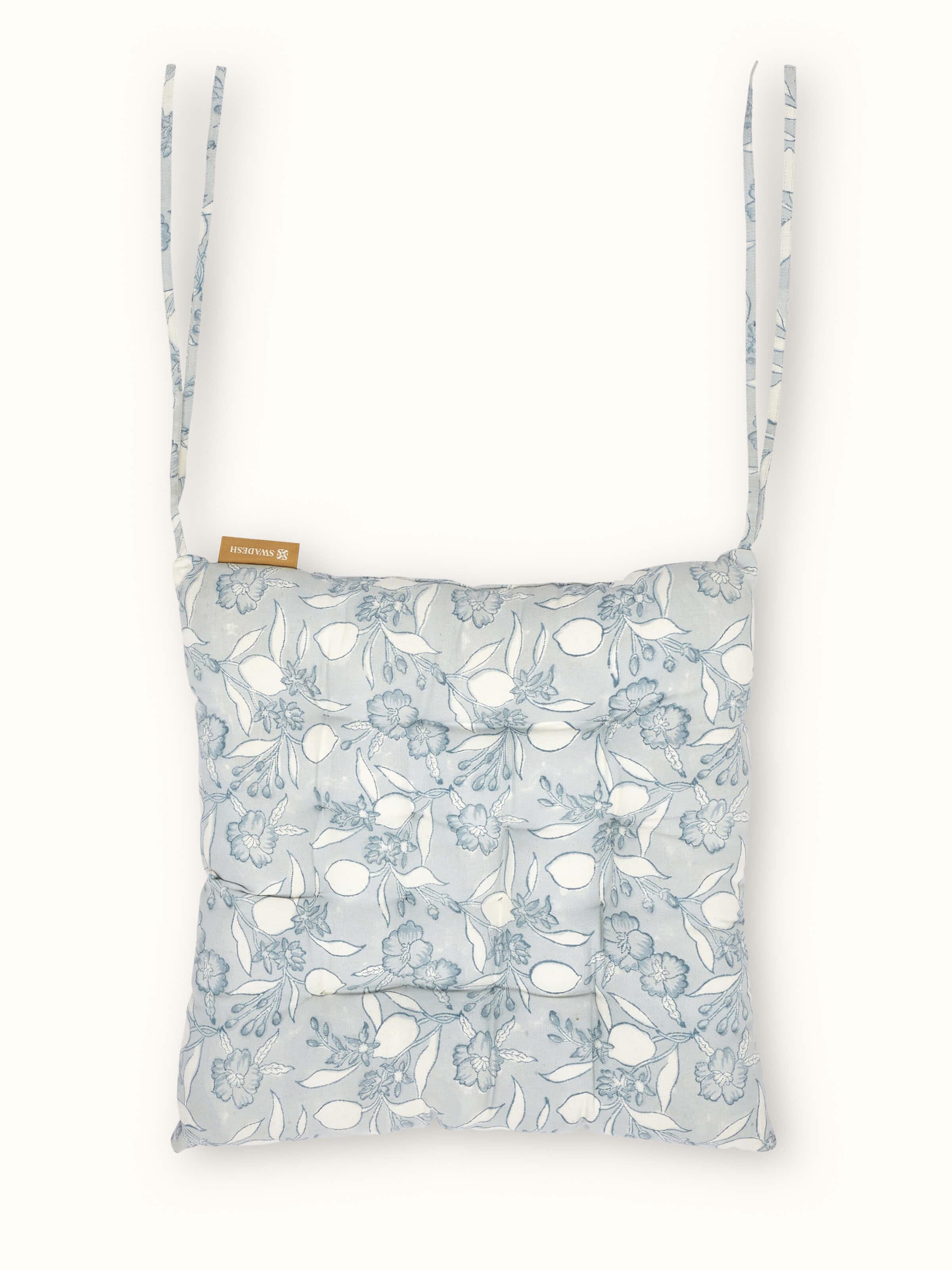 Full view of Anika light blue floral cotton Sanganeri block printed chair sitting cushion featuring a delicate floral design