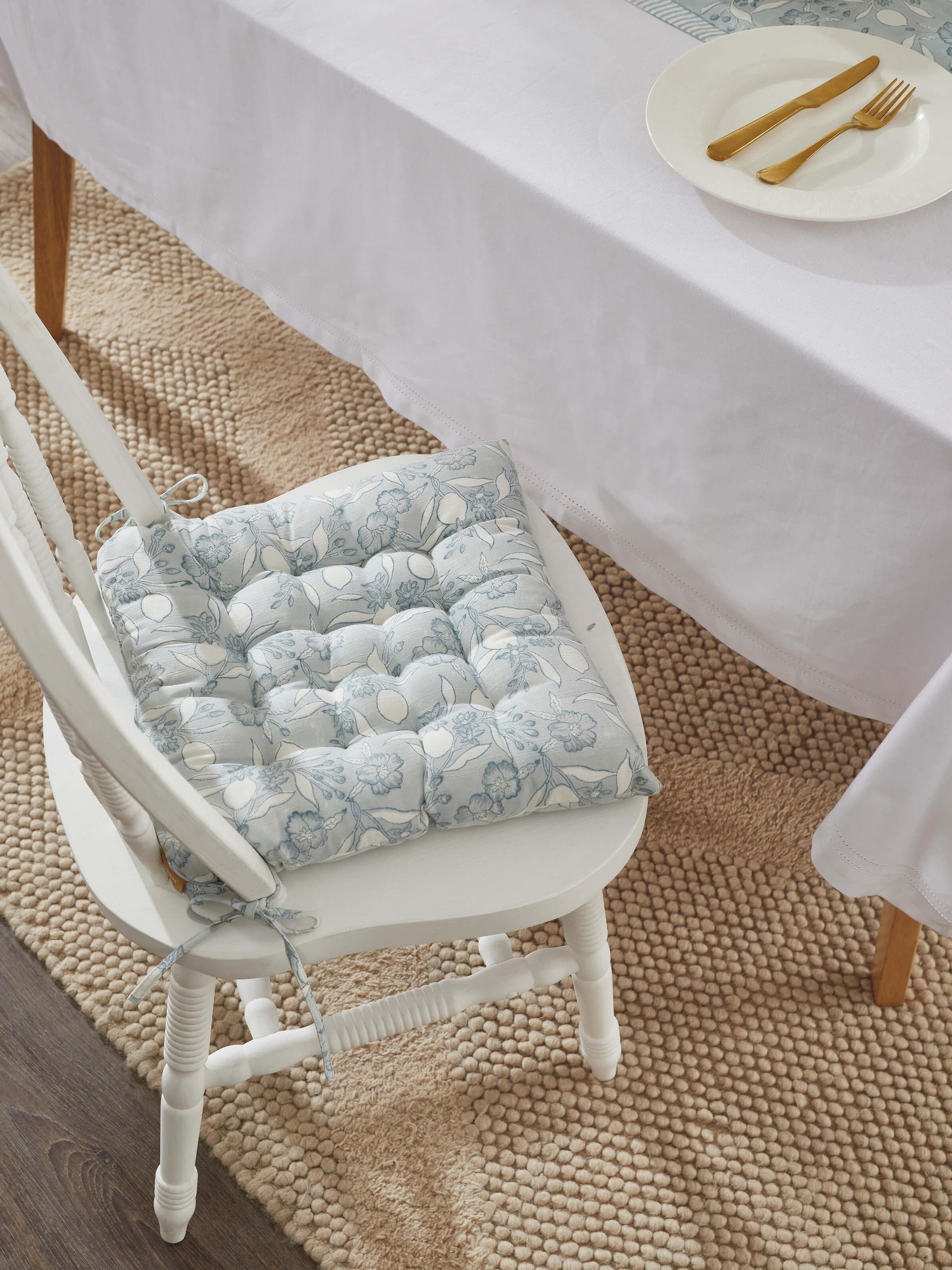 Close-up of Anika light blue floral cotton Sanganeri block printed chair sitting cushion showing the floral block print details