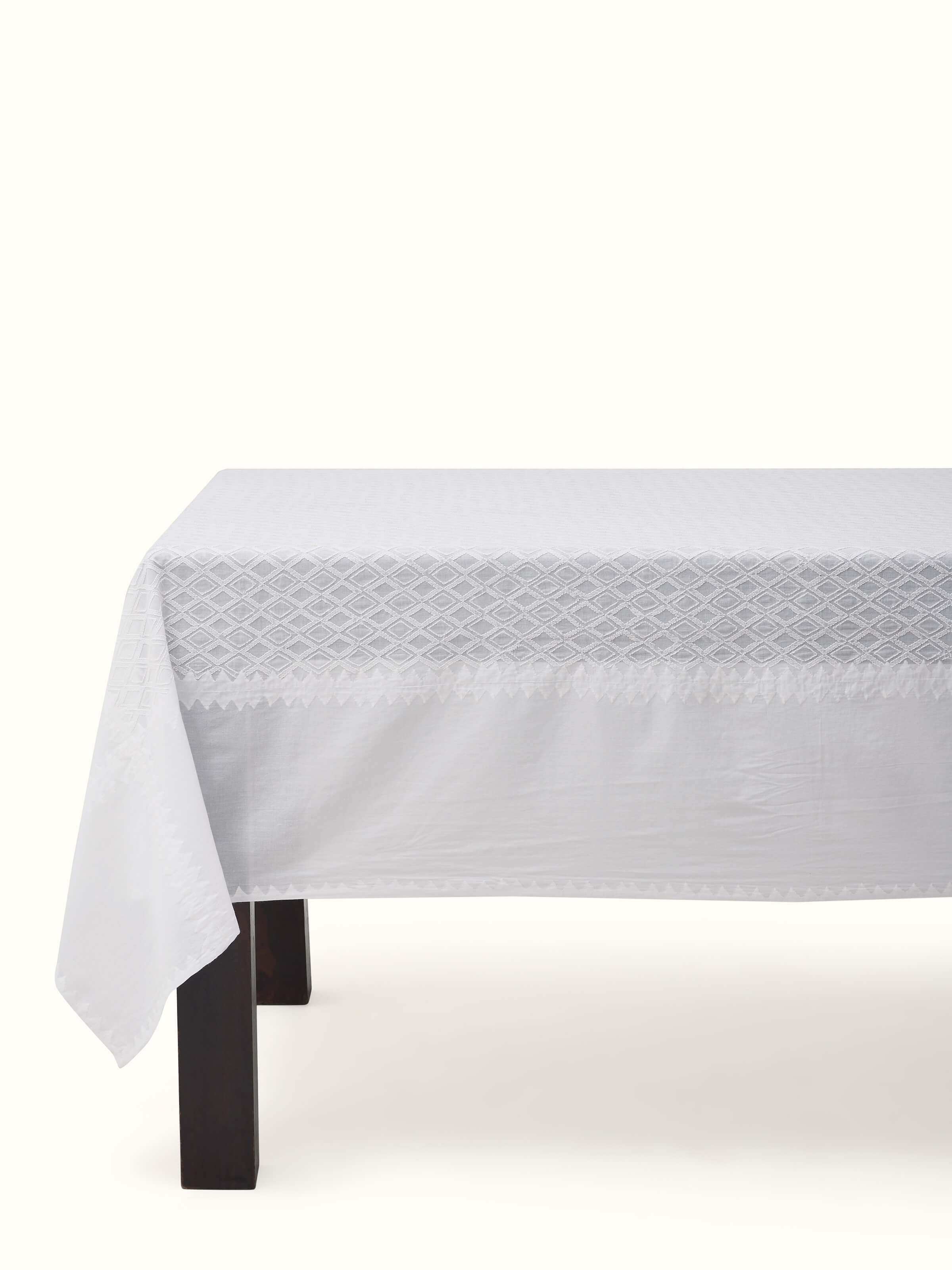 Ananda white geometric cotton Chikankari table cover (4 seater) with intricate geometric patterns and Chikankari embroidery.