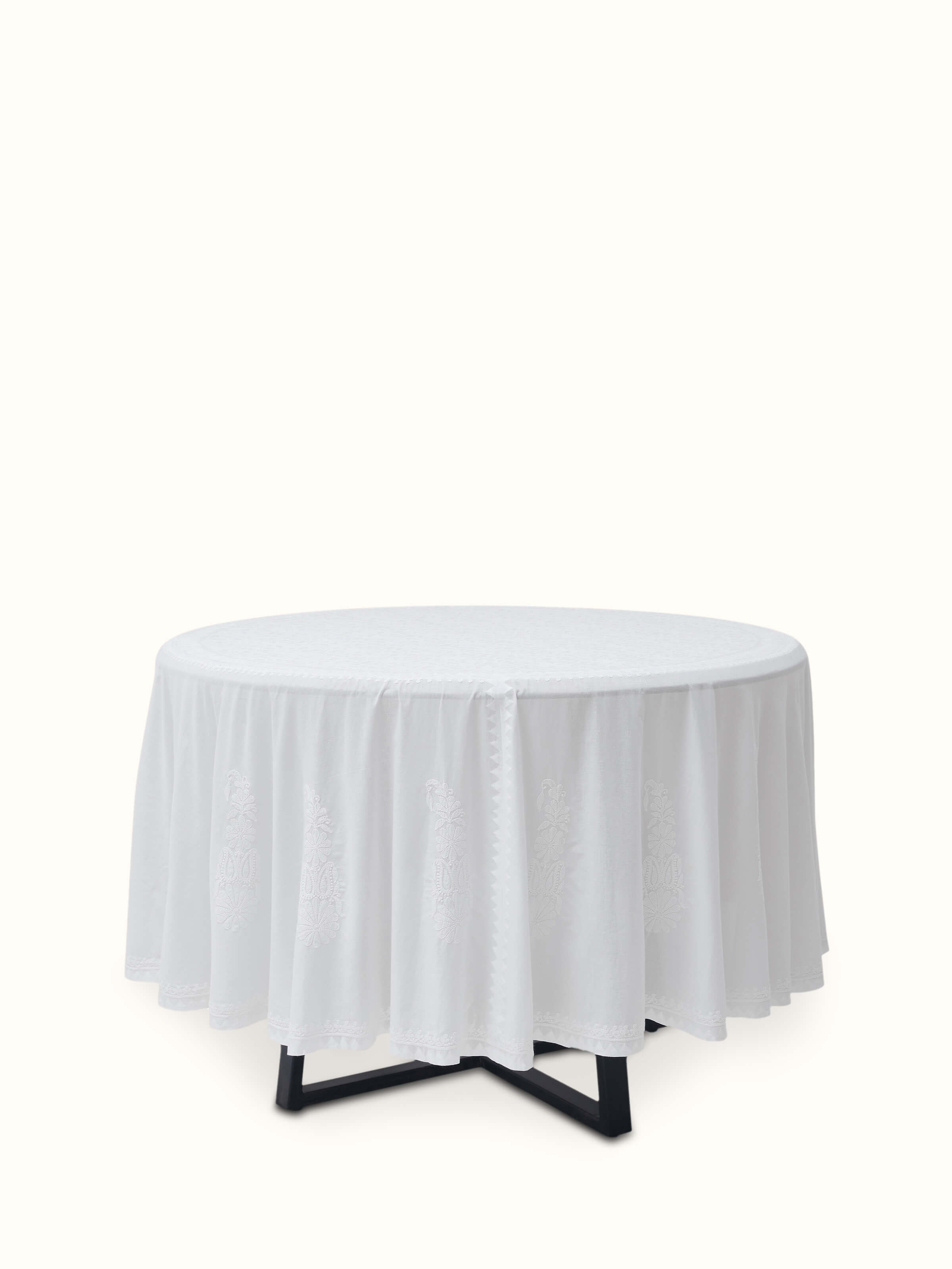 Front view of Ananda White Floral Round Cotton Chikankari Table Cover showcasing intricate floral embroidery.