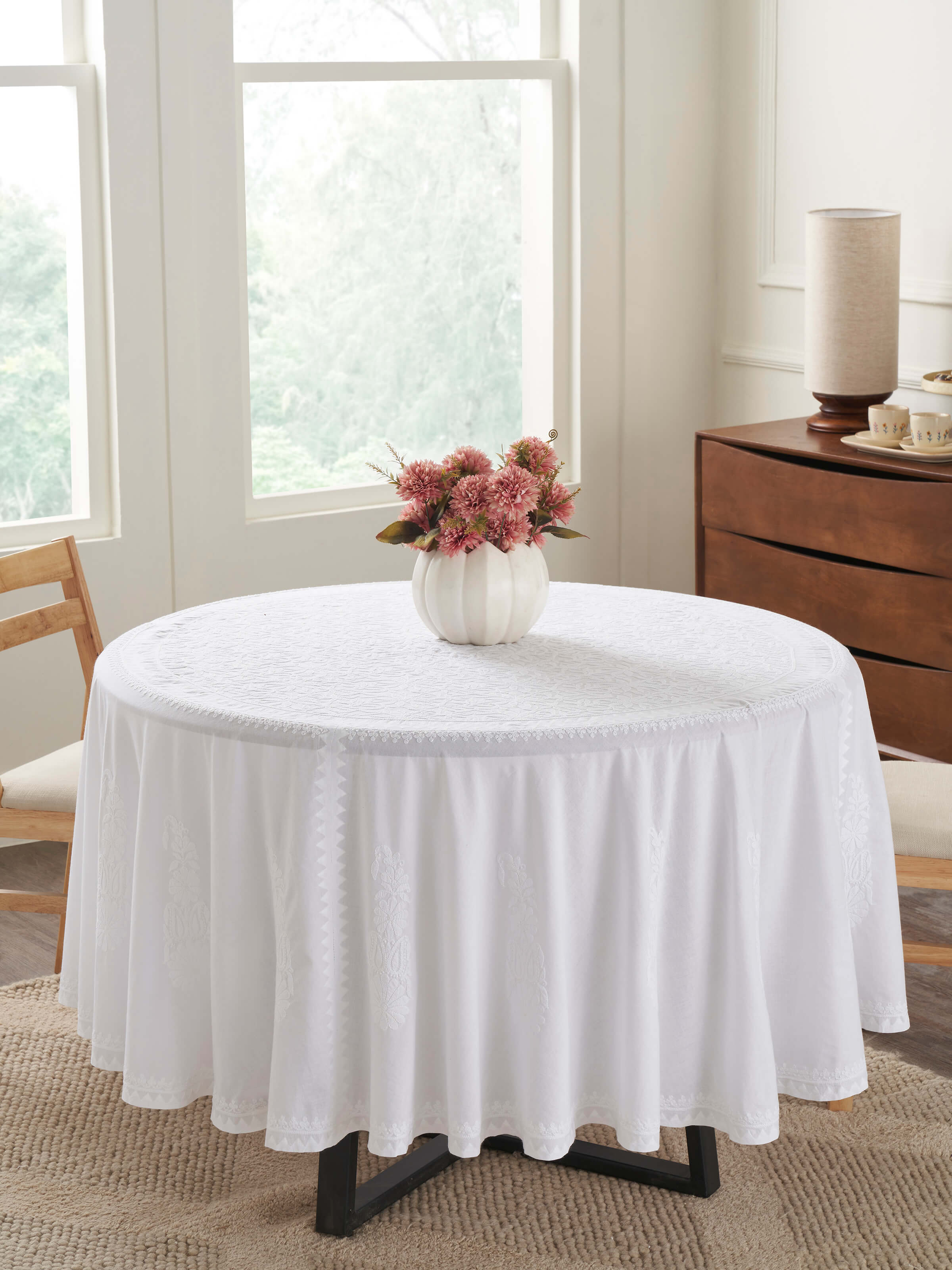 Detailed close-up of Ananda White Floral Round Cotton Chikankari Table Cover highlighting the floral patterns.
