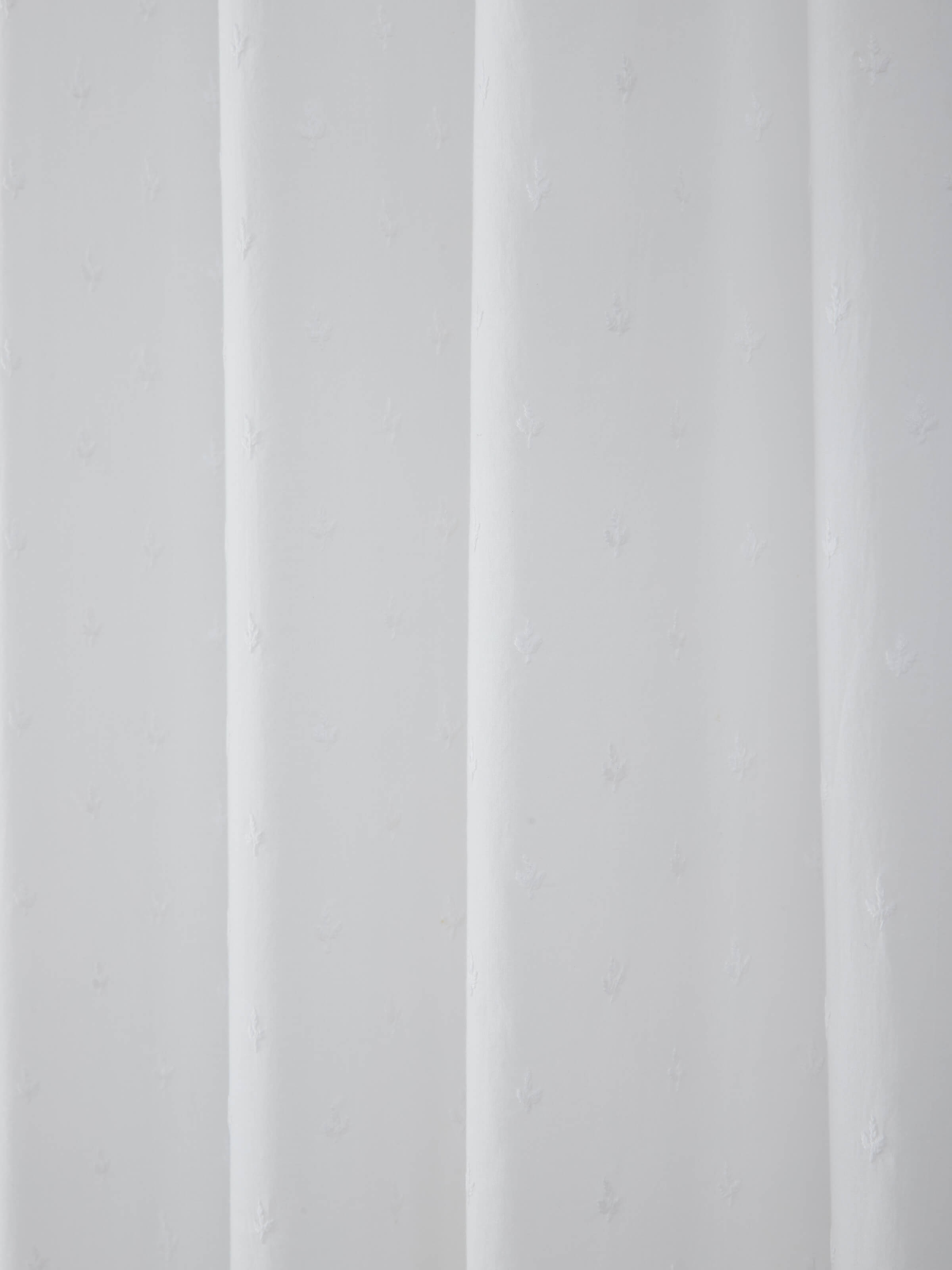 Side view of Svetah White Trellis Silk Cotton Chikankari Sheer Curtain emphasizing its delicate chikankari embroidery.